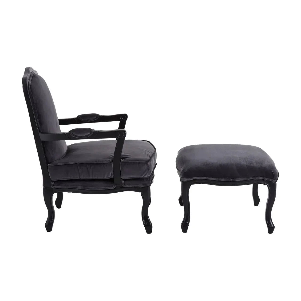 Black velvet armchair with matching ottoman, side view, curved wooden legs