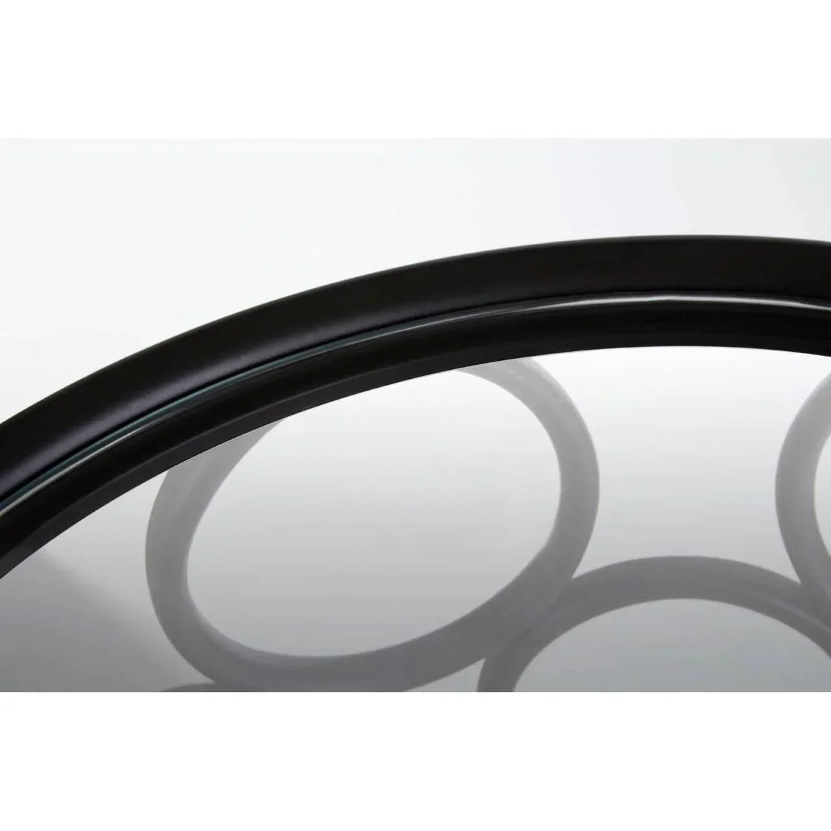 Black metal and glass coffee table edge with circular base detail