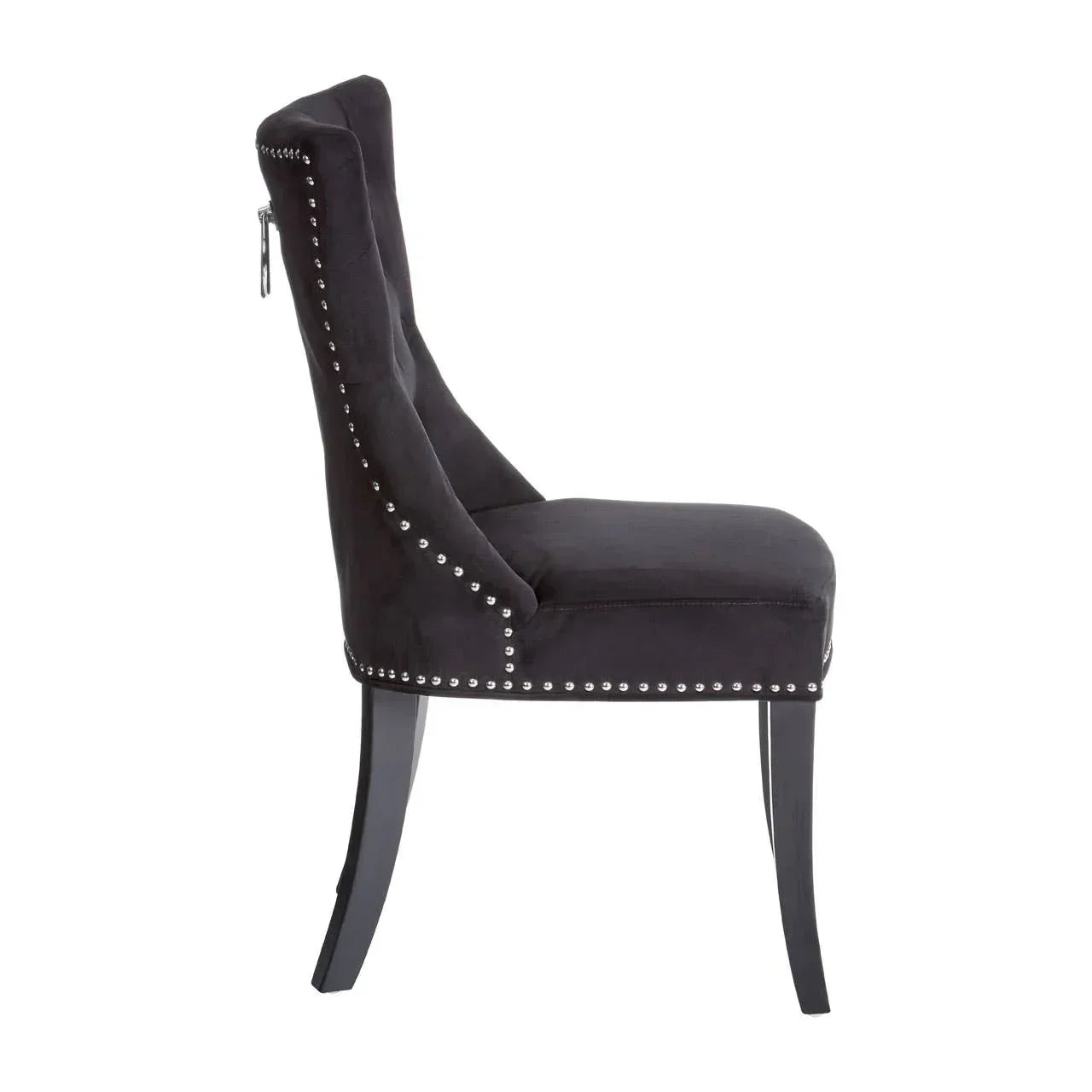 Black velvet dining chair with silver studs and curved legs, side profile