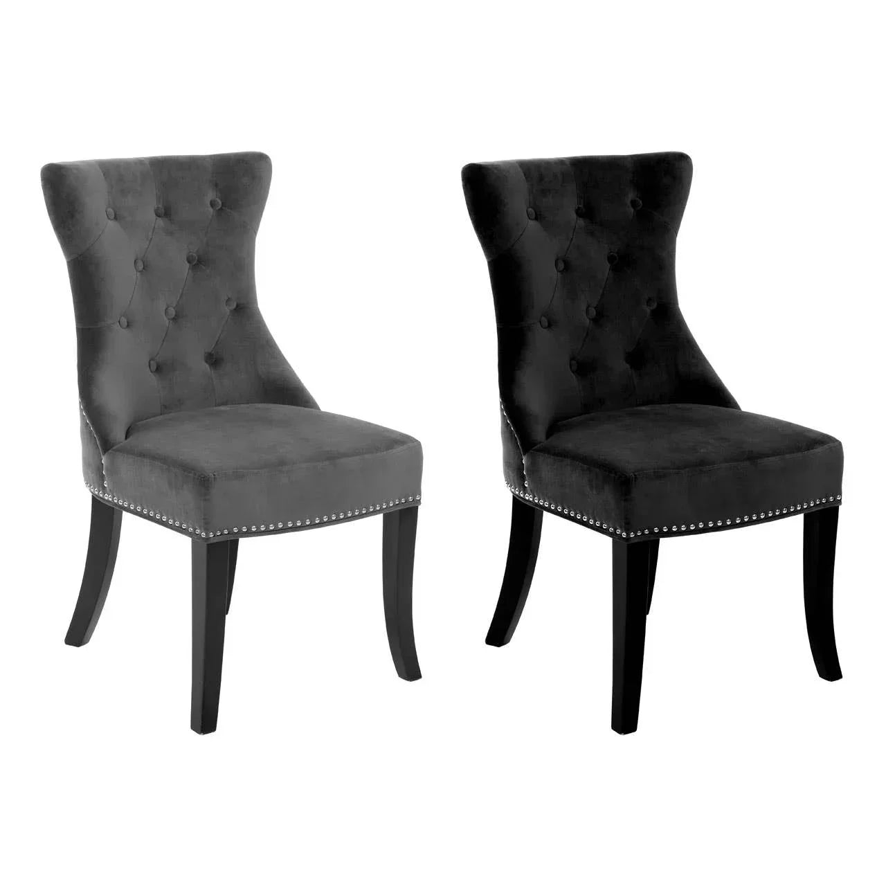 Pair of black velvet dining chairs with button-tufted back and silver stud detailing