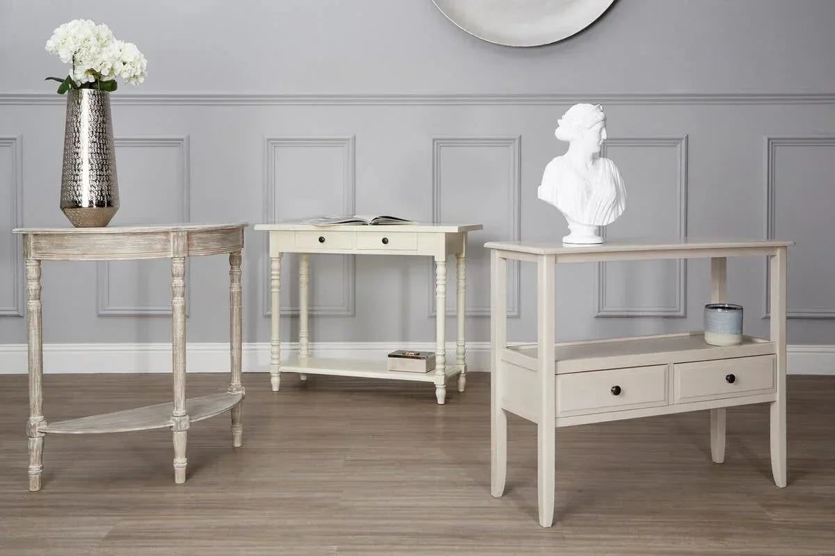 Cream console tables with decorative drawers and shelving in modern living room setting