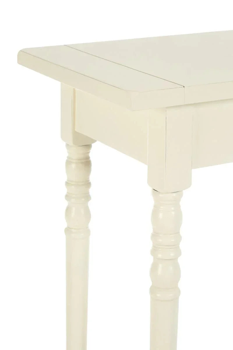 Ivory wood dining table with turned legs and clean rectangular top, close-up view