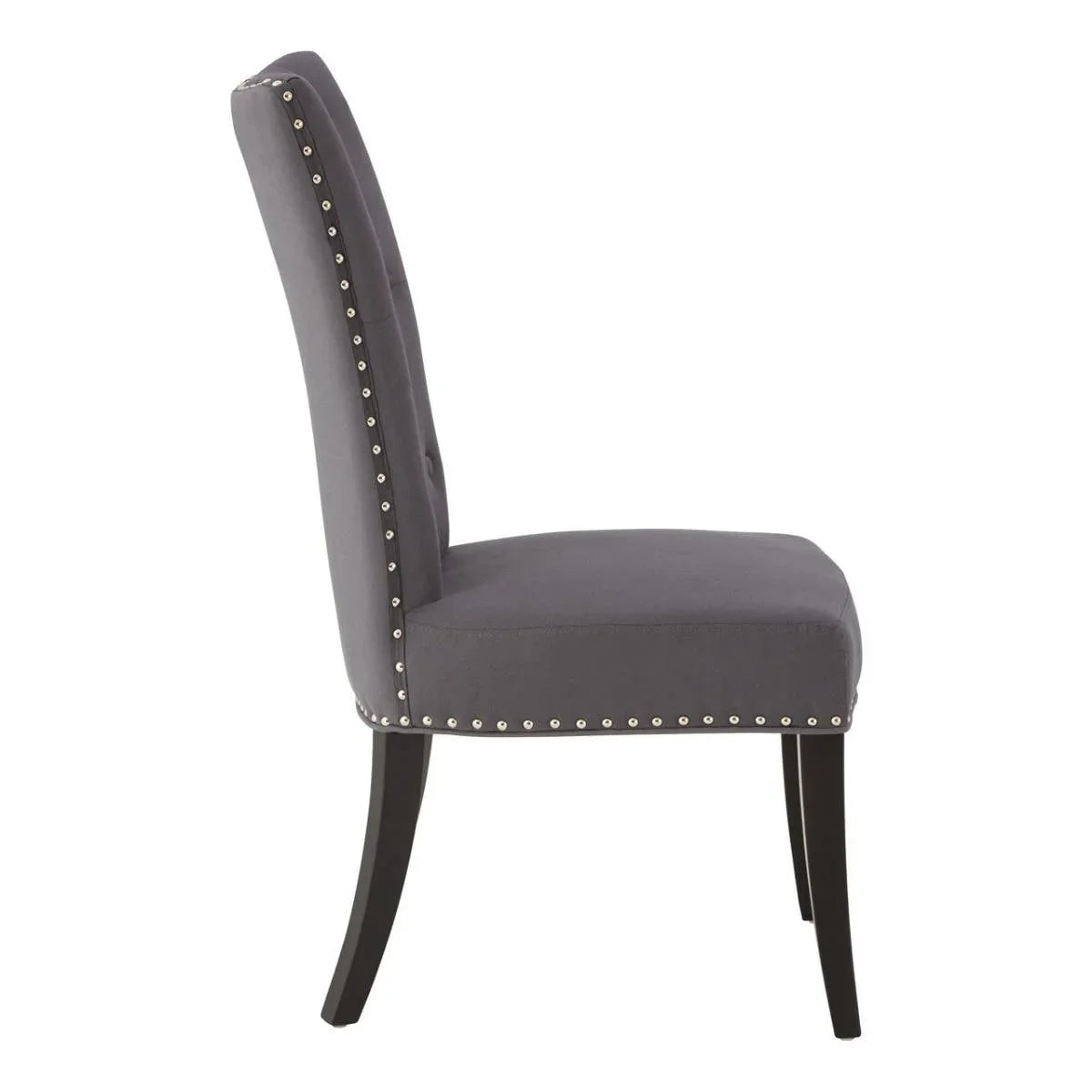 Grey upholstered dining chair with silver stud trim and black wooden legs side view