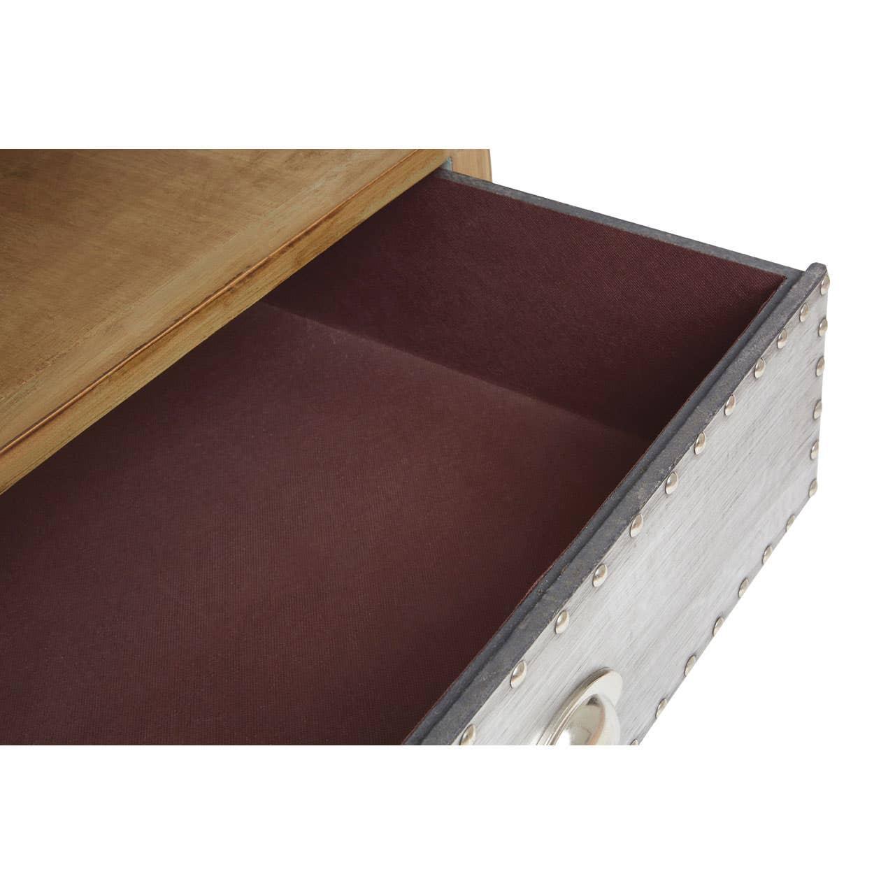 Closeup of open wooden drawer with metal rivet detail and silver handle