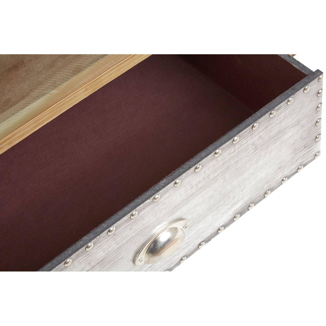 Open wooden drawer with metal handle and stud detailing, showing interior storage space