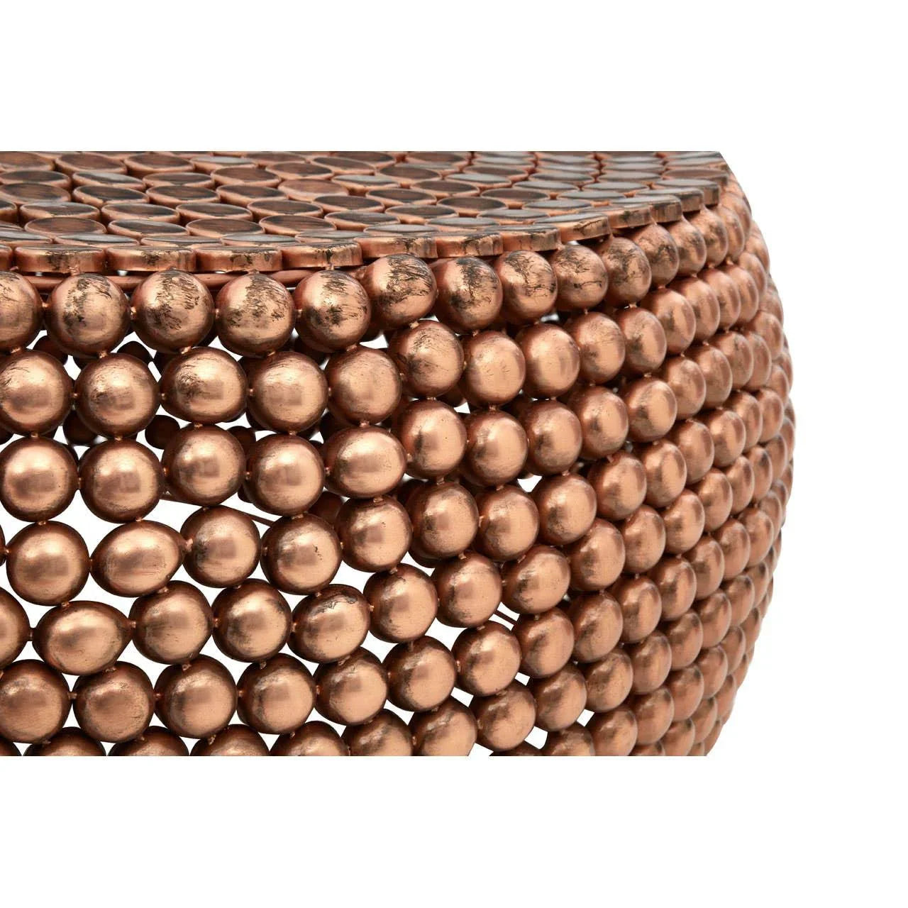 Round copper coffee table with textured ball detail and close-up surface view