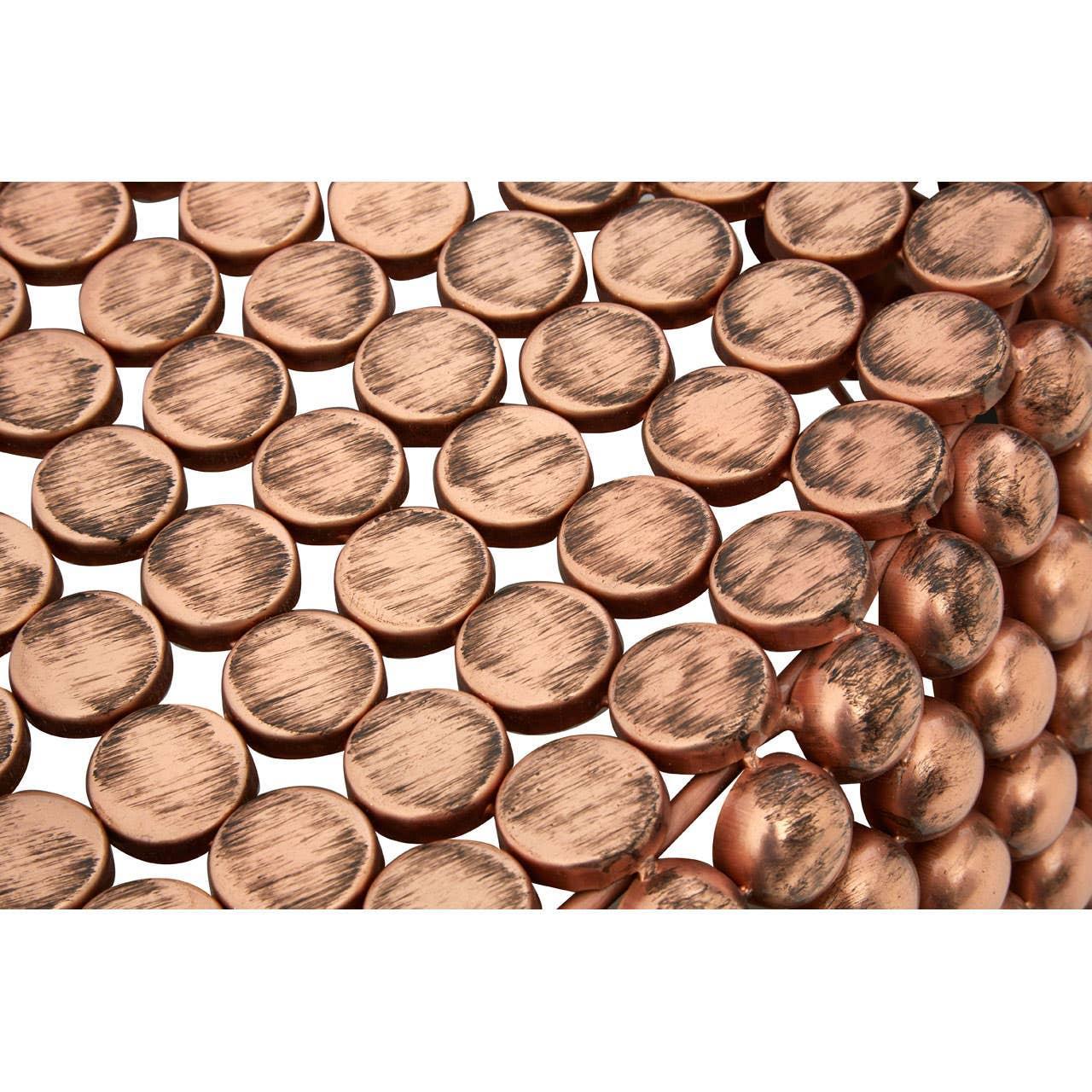 Close-up of round bronze metal accents on decorative furniture table surface