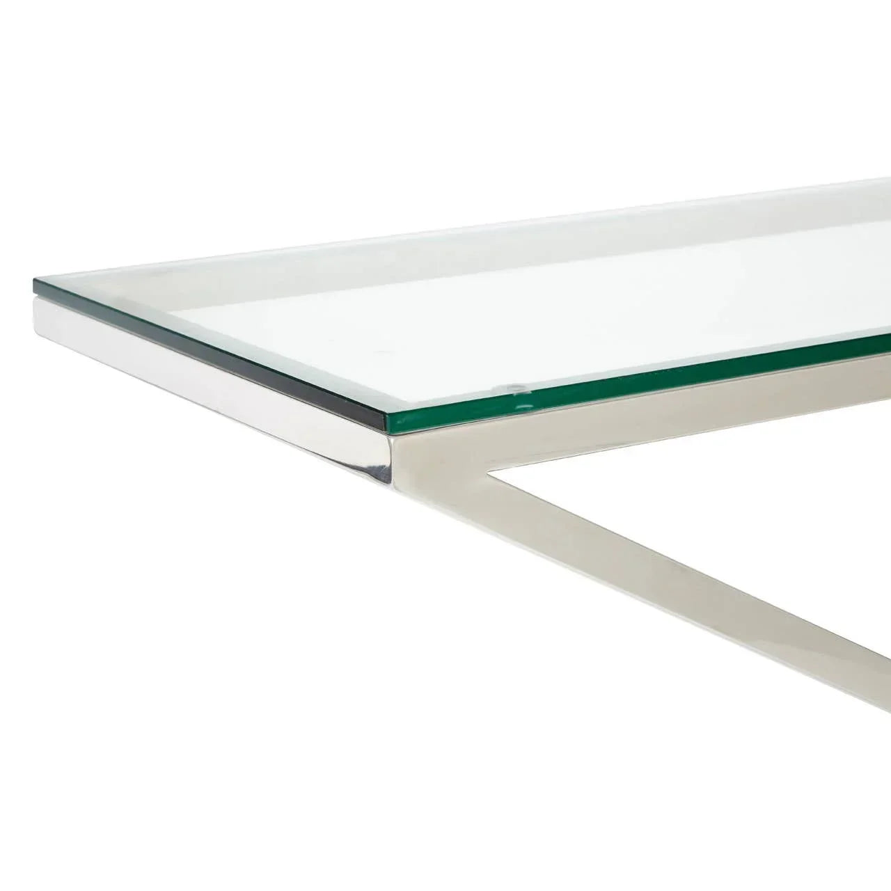 Clear glass table top with polished chrome frame, close-up of corner detail