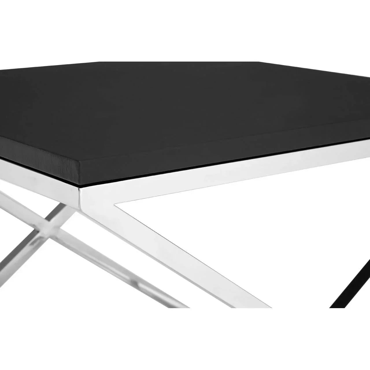 Black square coffee table with chrome metal frame, close-up of tabletop and corner