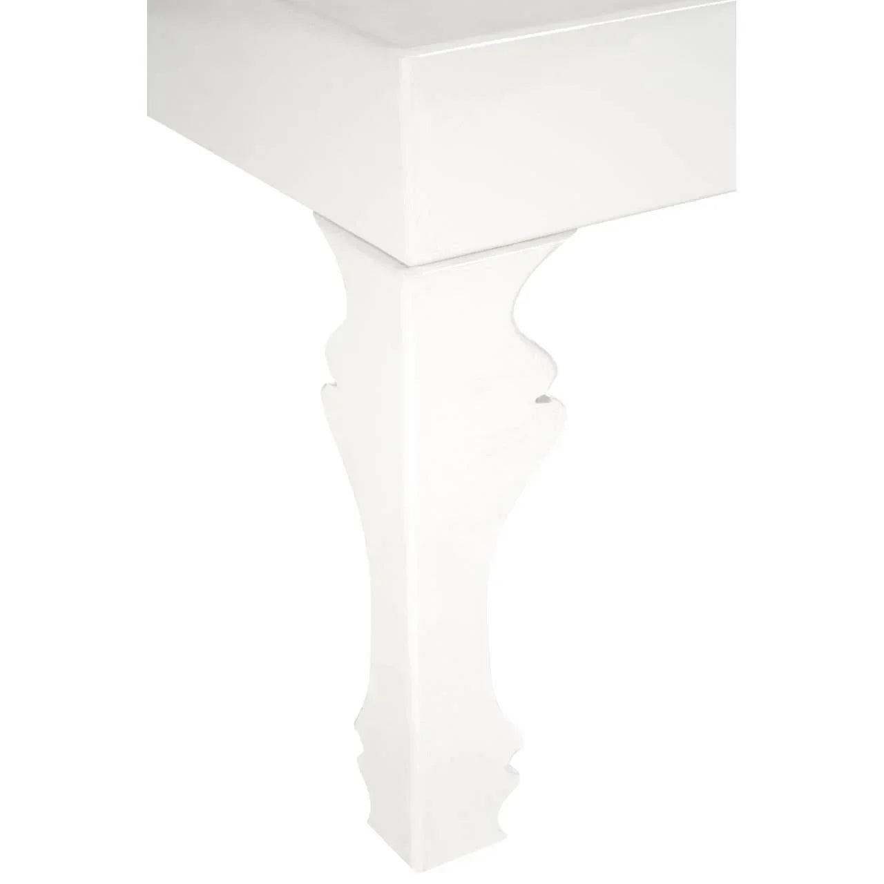 White wooden table corner with carved leg detail