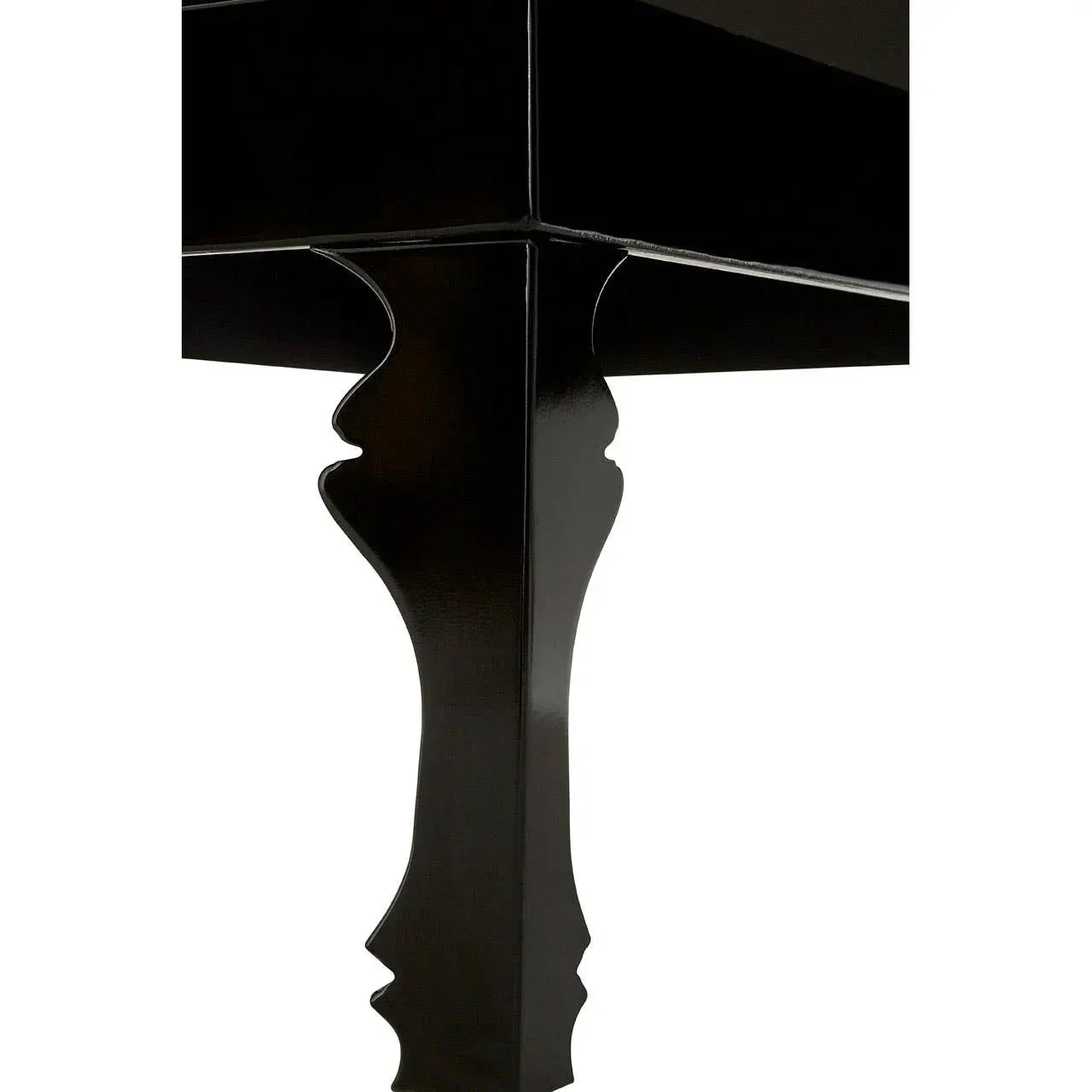 Gloss black dining table corner with decorative carved wooden leg detail
