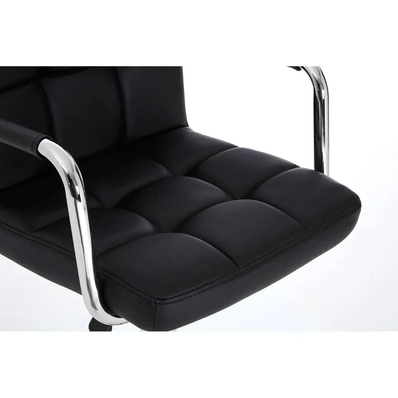 Black leather office chair seat with chrome armrests close up