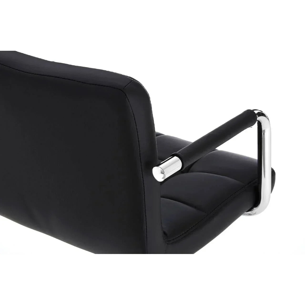 Black office chair with chrome armrest and cushioned backrest, side angle view