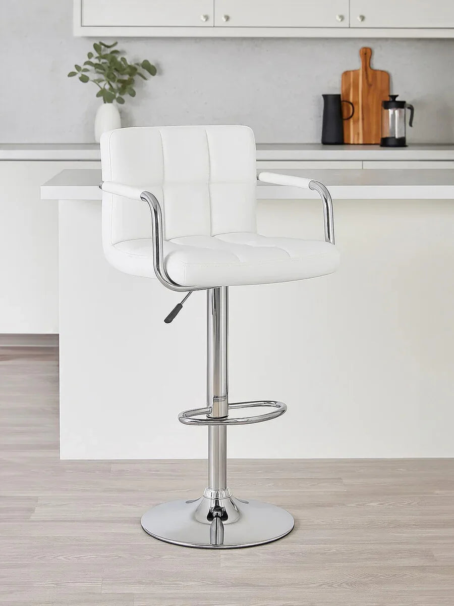 White leather bar stool with chrome base and footrest in modern kitchen setting