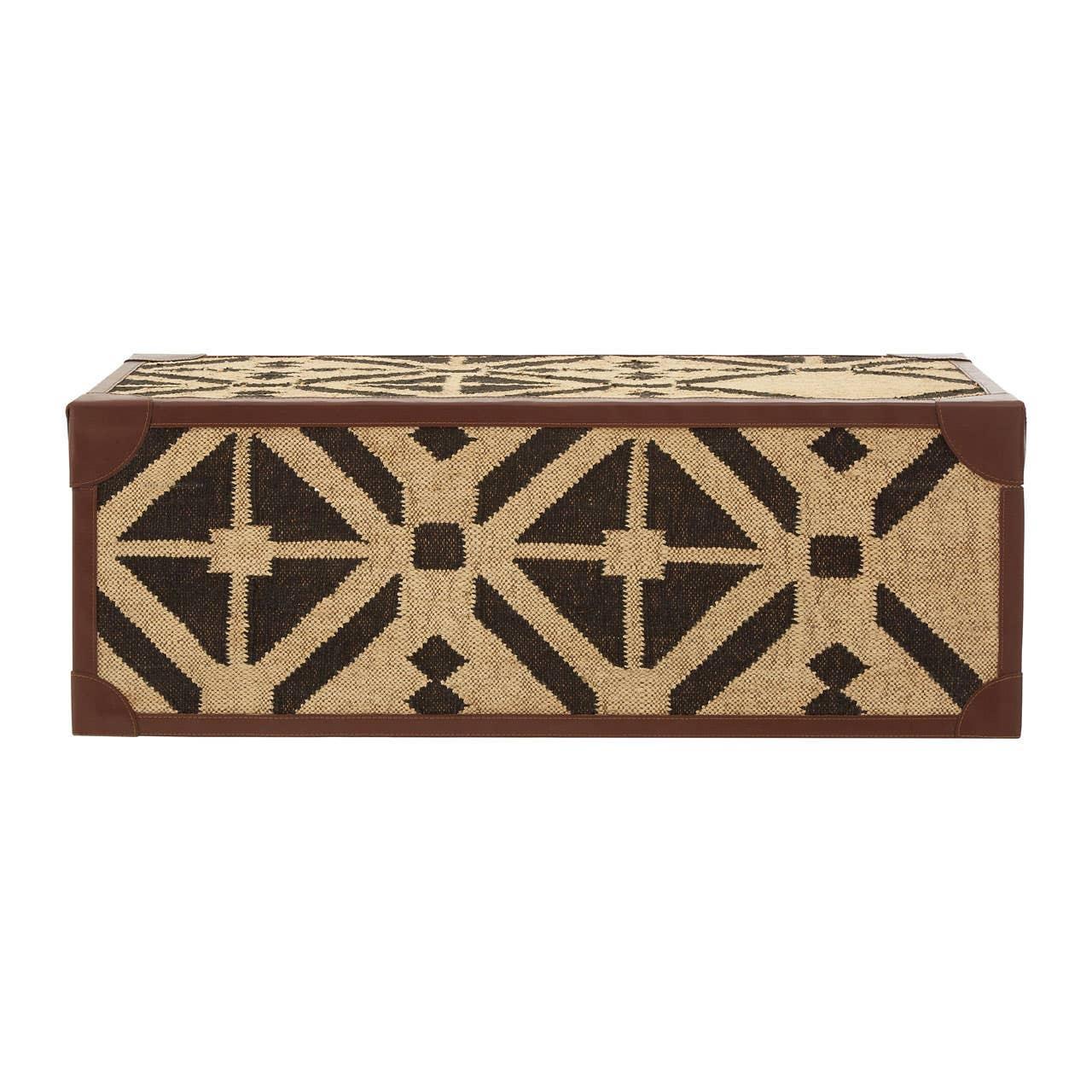 Rectangular storage trunk with geometric black and beige woven pattern and brown corner accents
