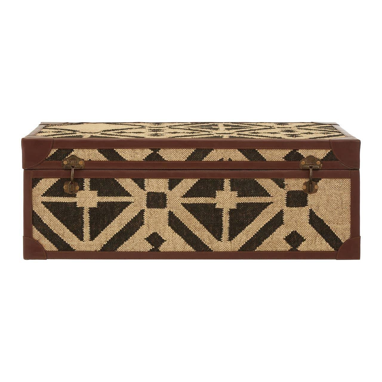Patterned storage trunk with black geometric design and brown leather corners