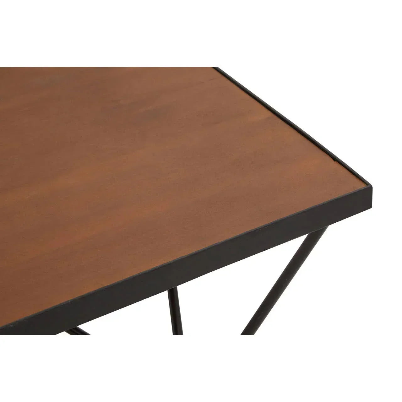 Close-up of wooden dining table with black metal frame and legs