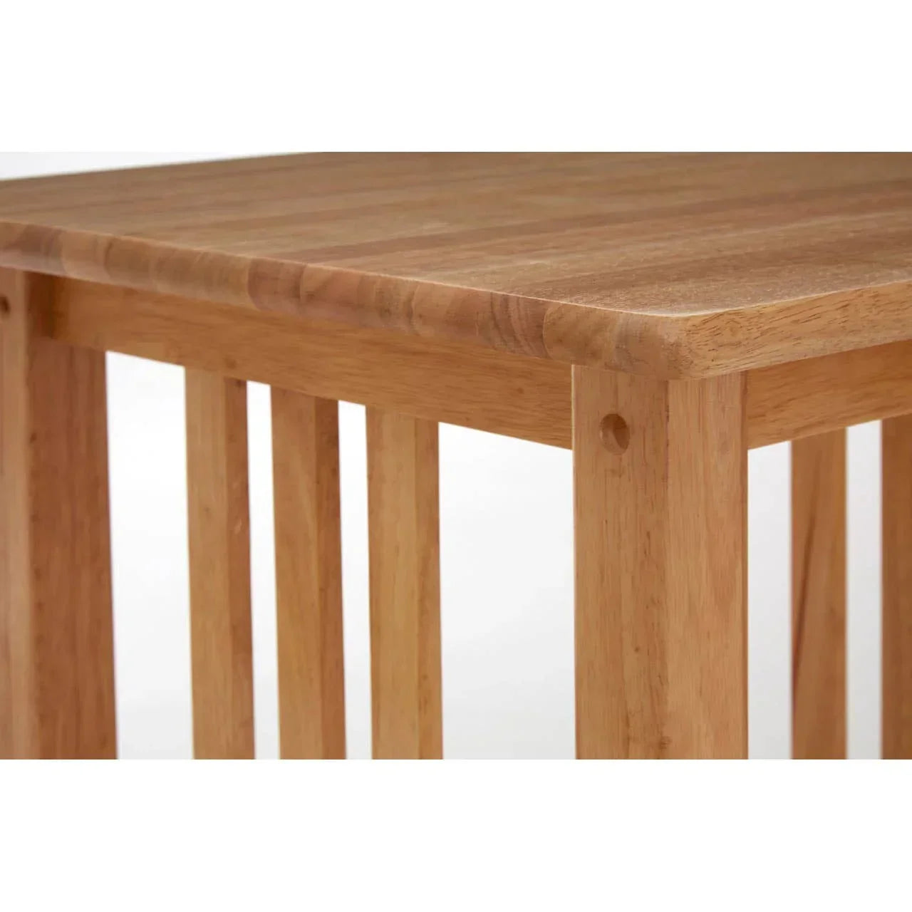 oak coffee table corner showing wood grain and slatted leg design