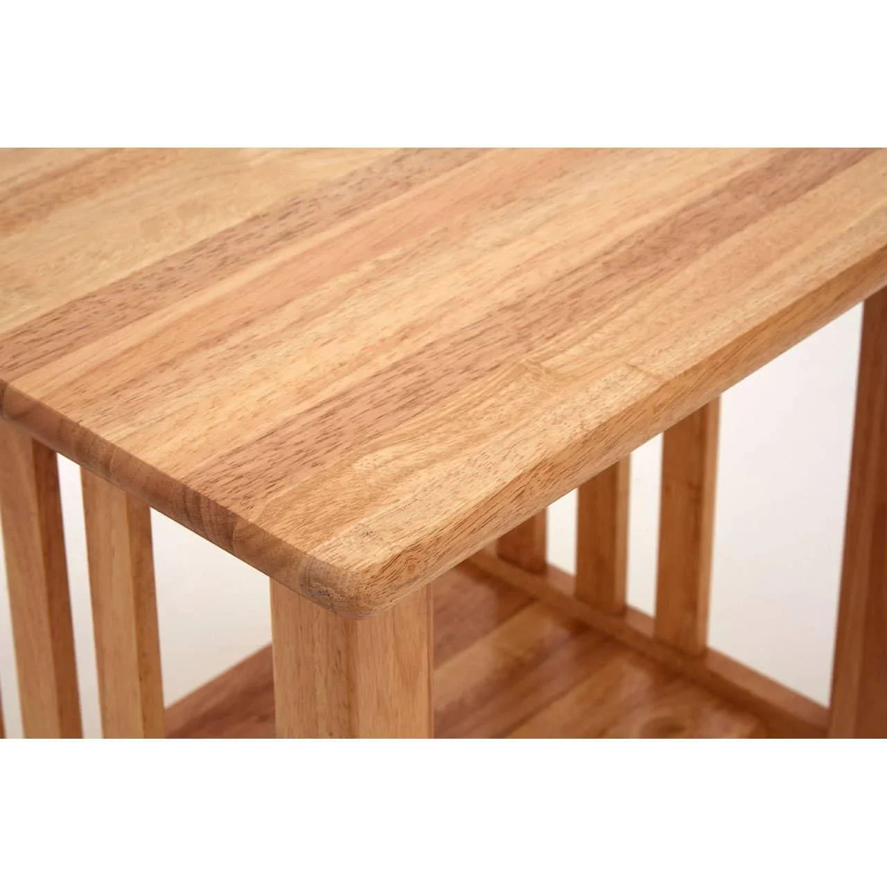 Close-up of solid wood side table with natural finish and lower shelf