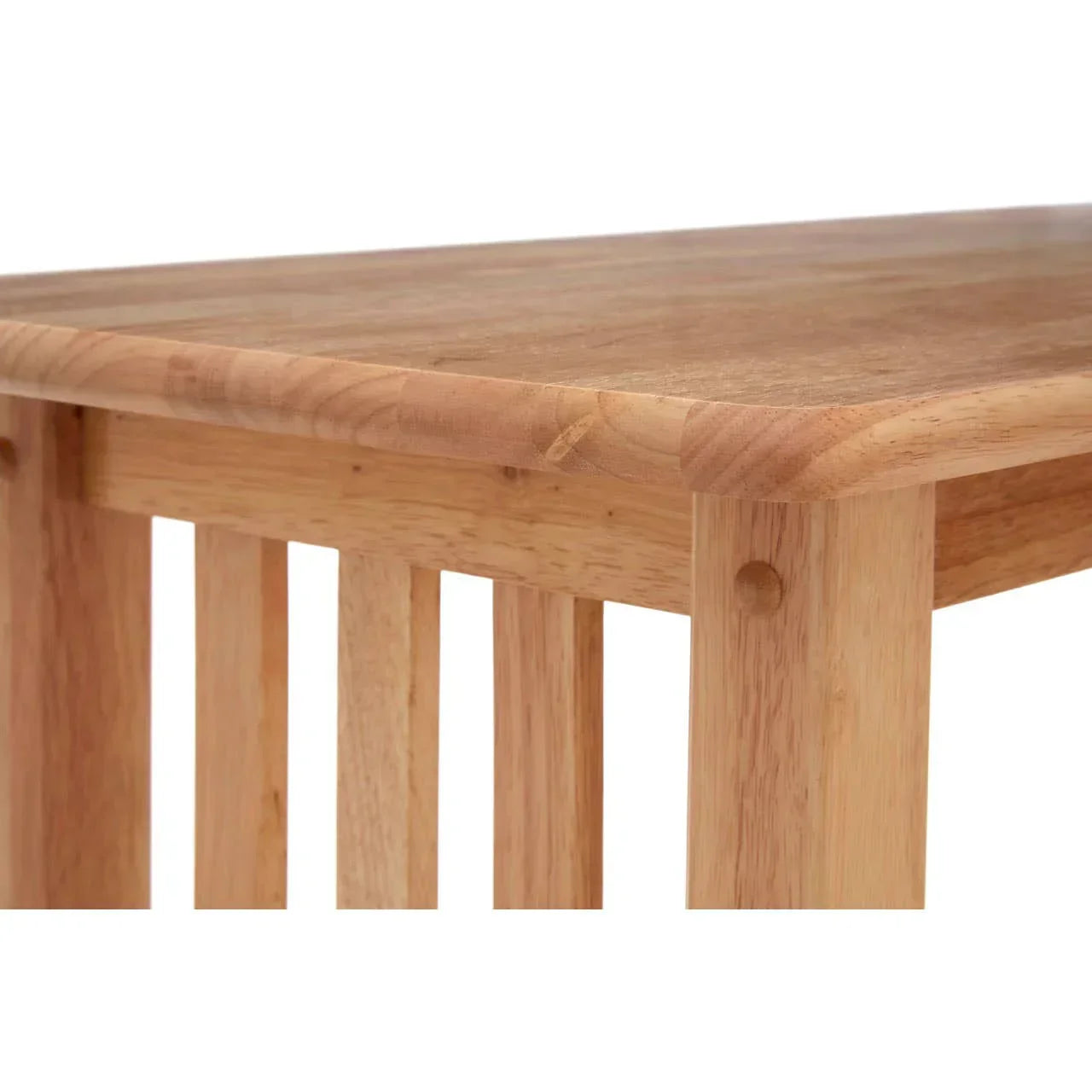 Close up of wooden dining table corner with slatted leg detail and smooth natural finish