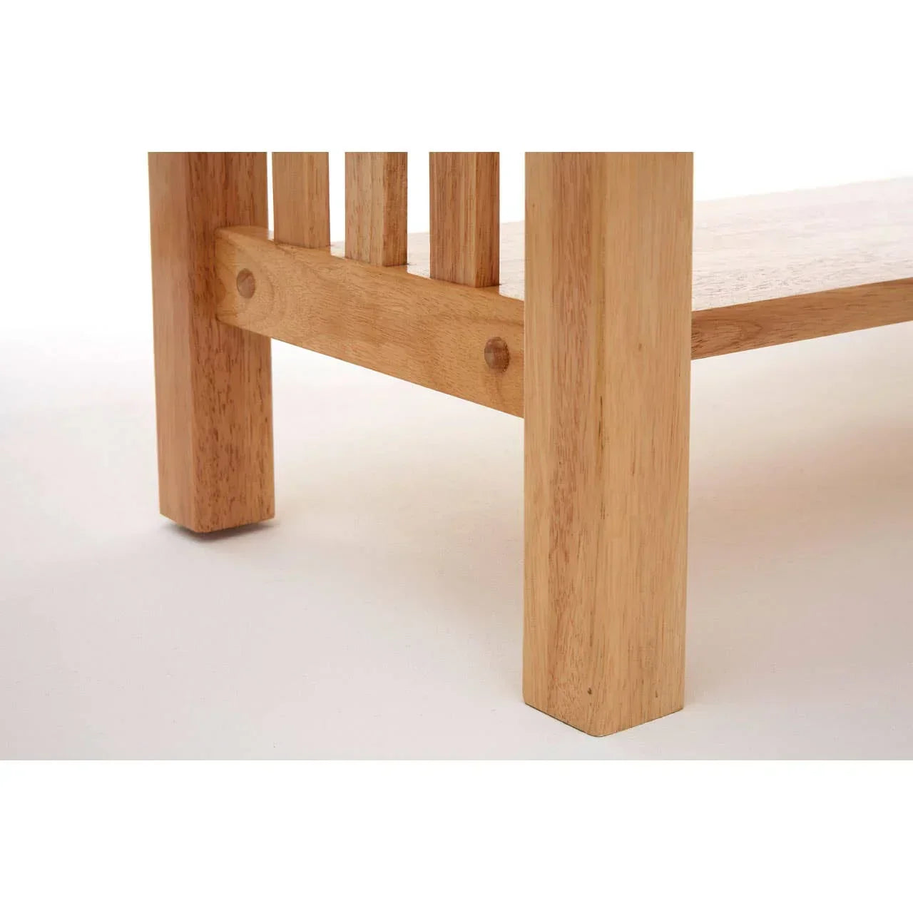 Close view of solid wood table leg and slatted shelf with natural finish