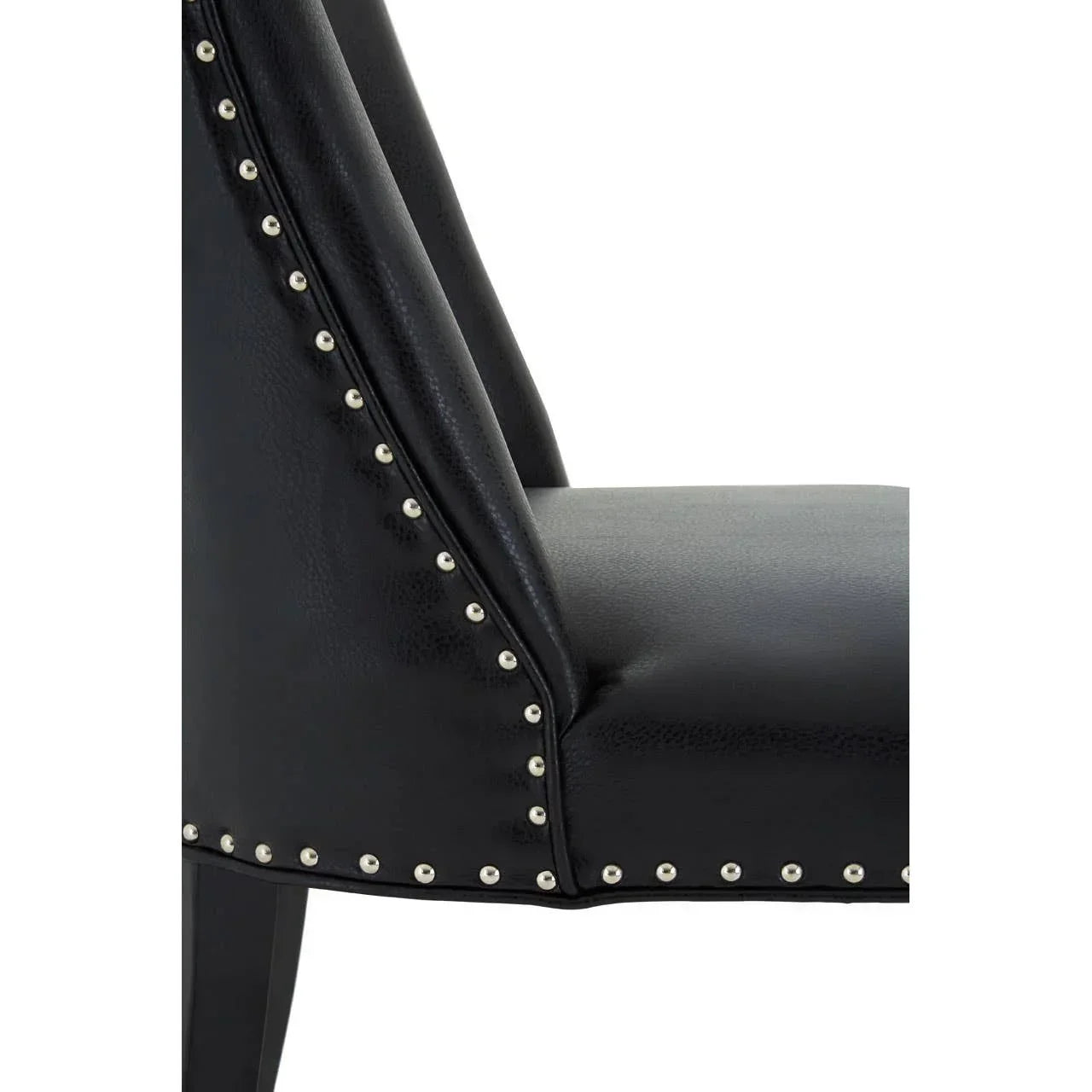 Black dining chair with silver stud detailing and faux leather upholstery side view