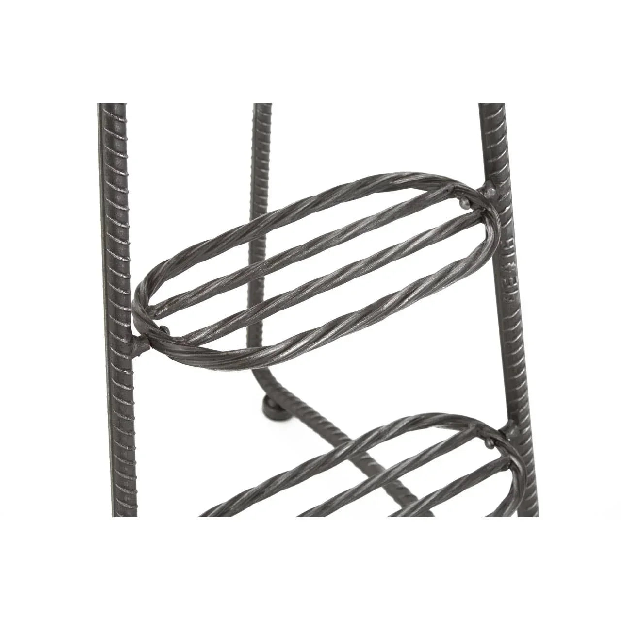 Closeup of black metal wine rack shelf with twisted bar design