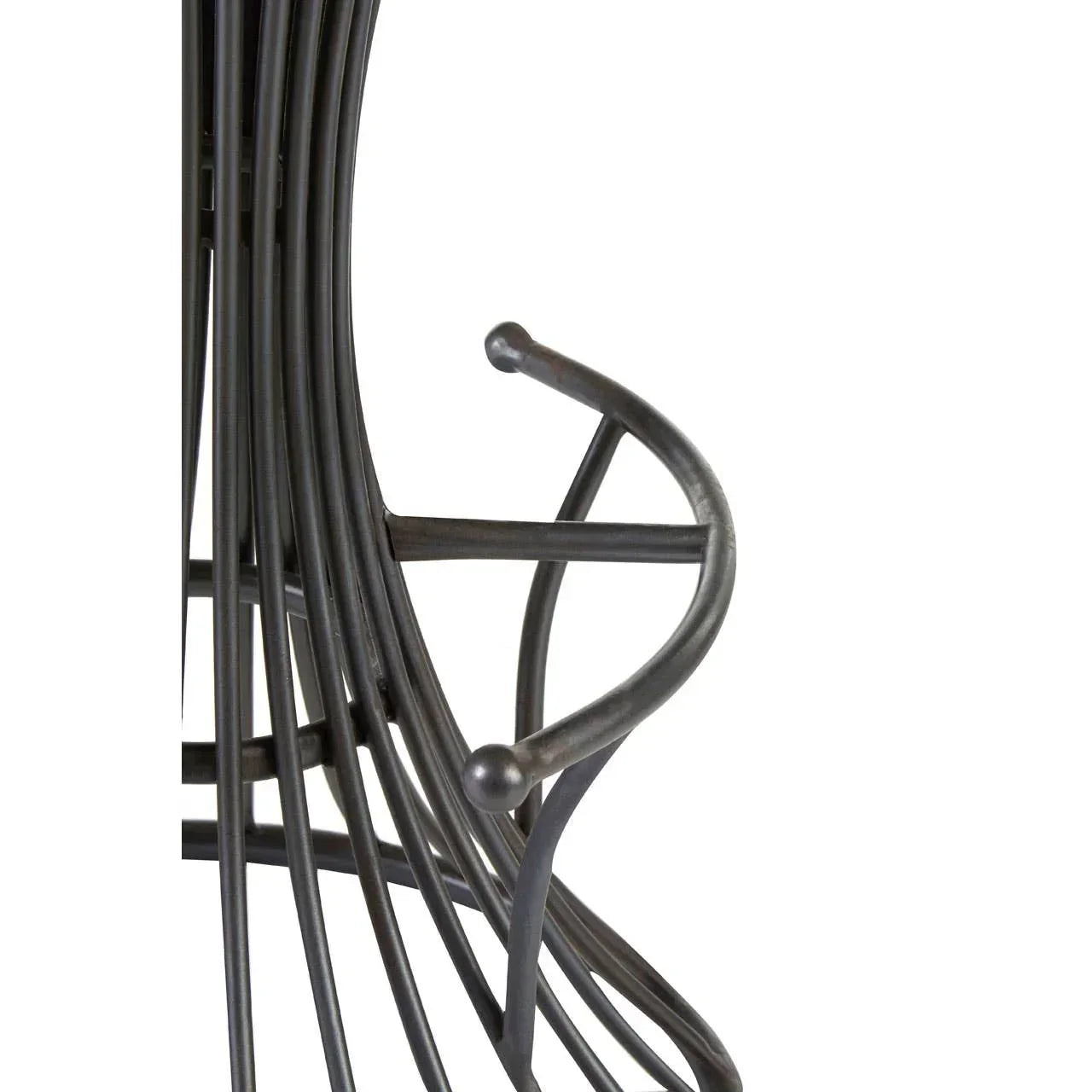 Curved metal furniture leg detail with black finish