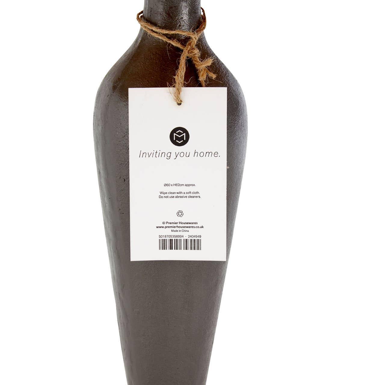 Brown ceramic vase with rope tie and product tag, close-up of back label and texture