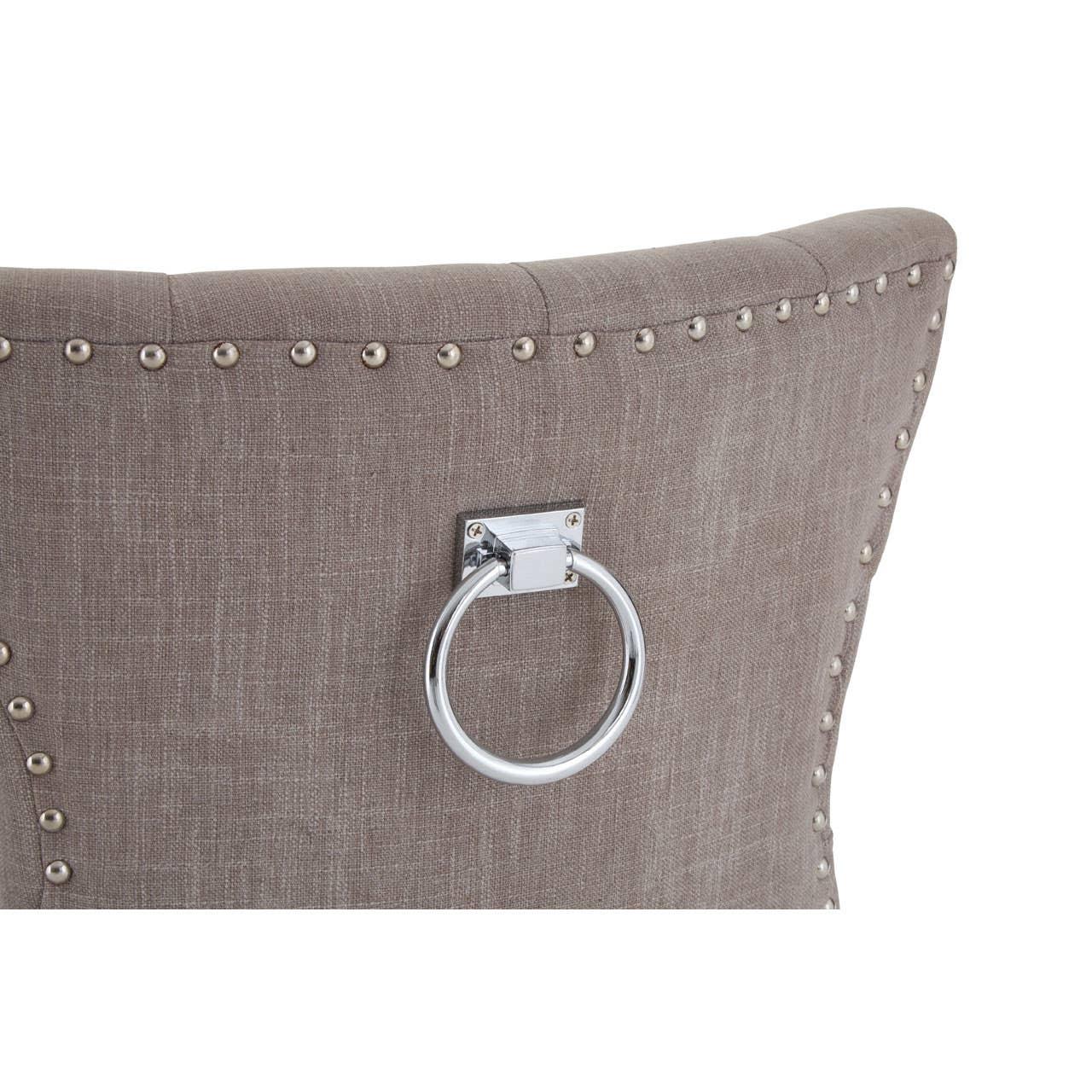 Upholstered dining chair back with stud detailing and chrome ring handle