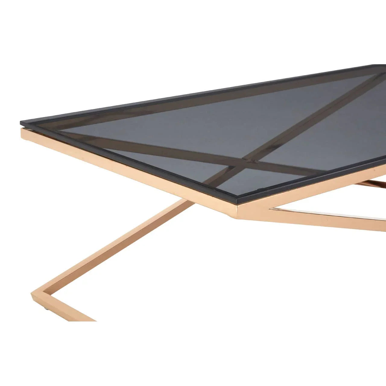 Modern glass coffee table with gold metal frame and geometric base, close view