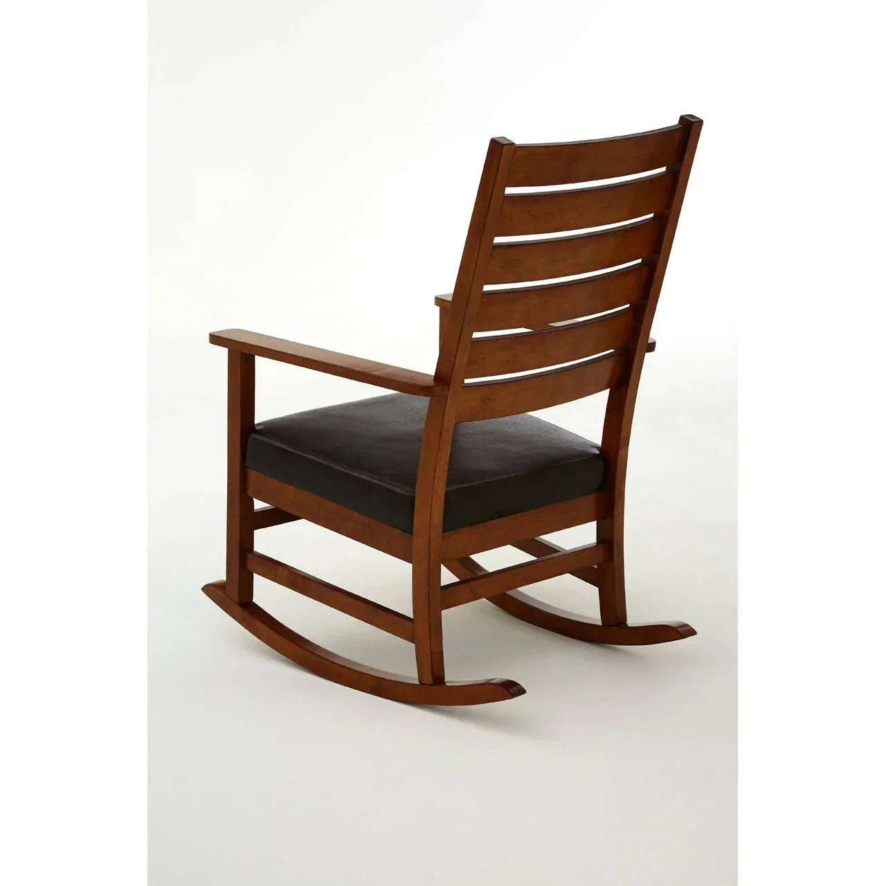 Wooden rocking chair with slatted back and black cushioned seat, rear view