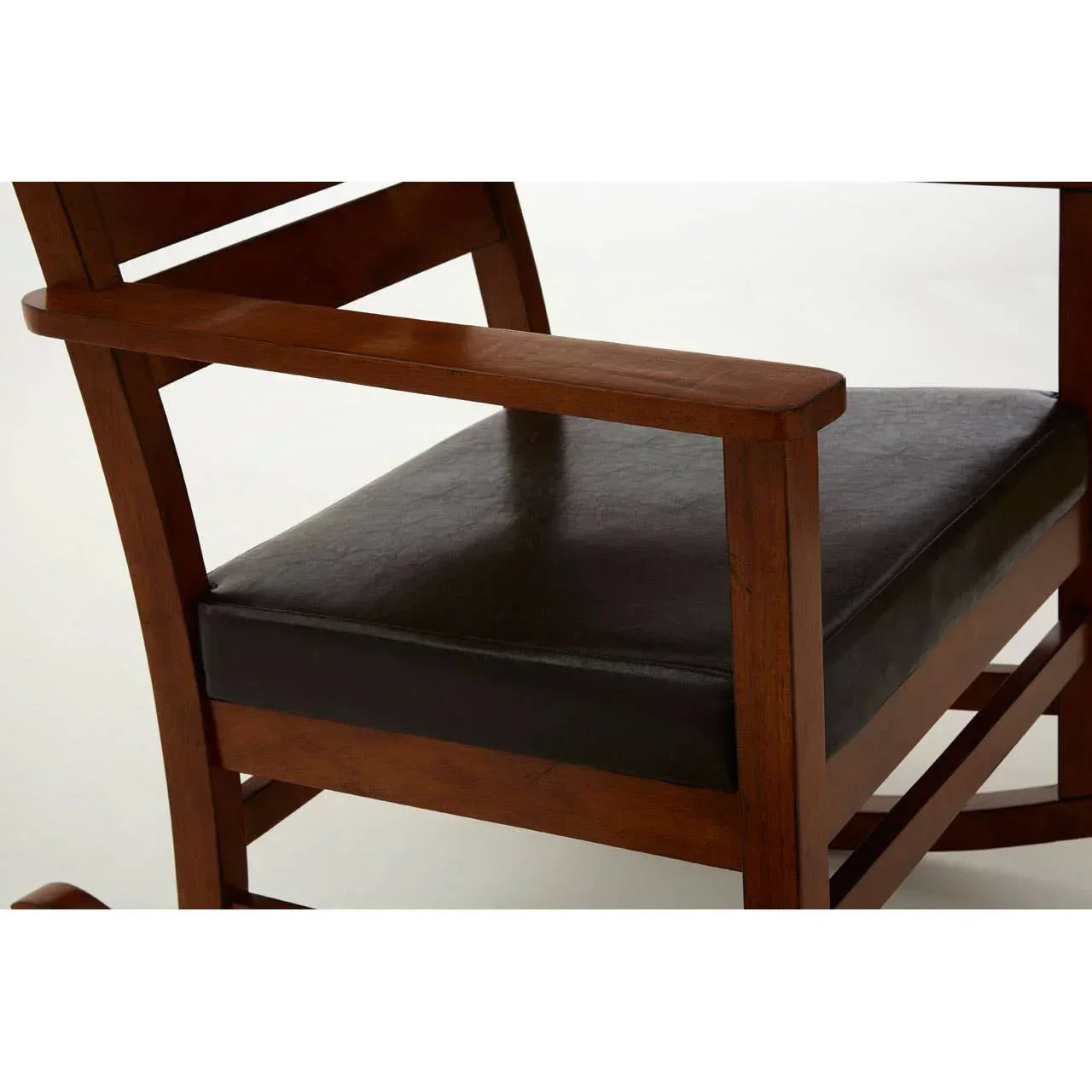 Wooden armchair with dark leather seat cushion, side angle view