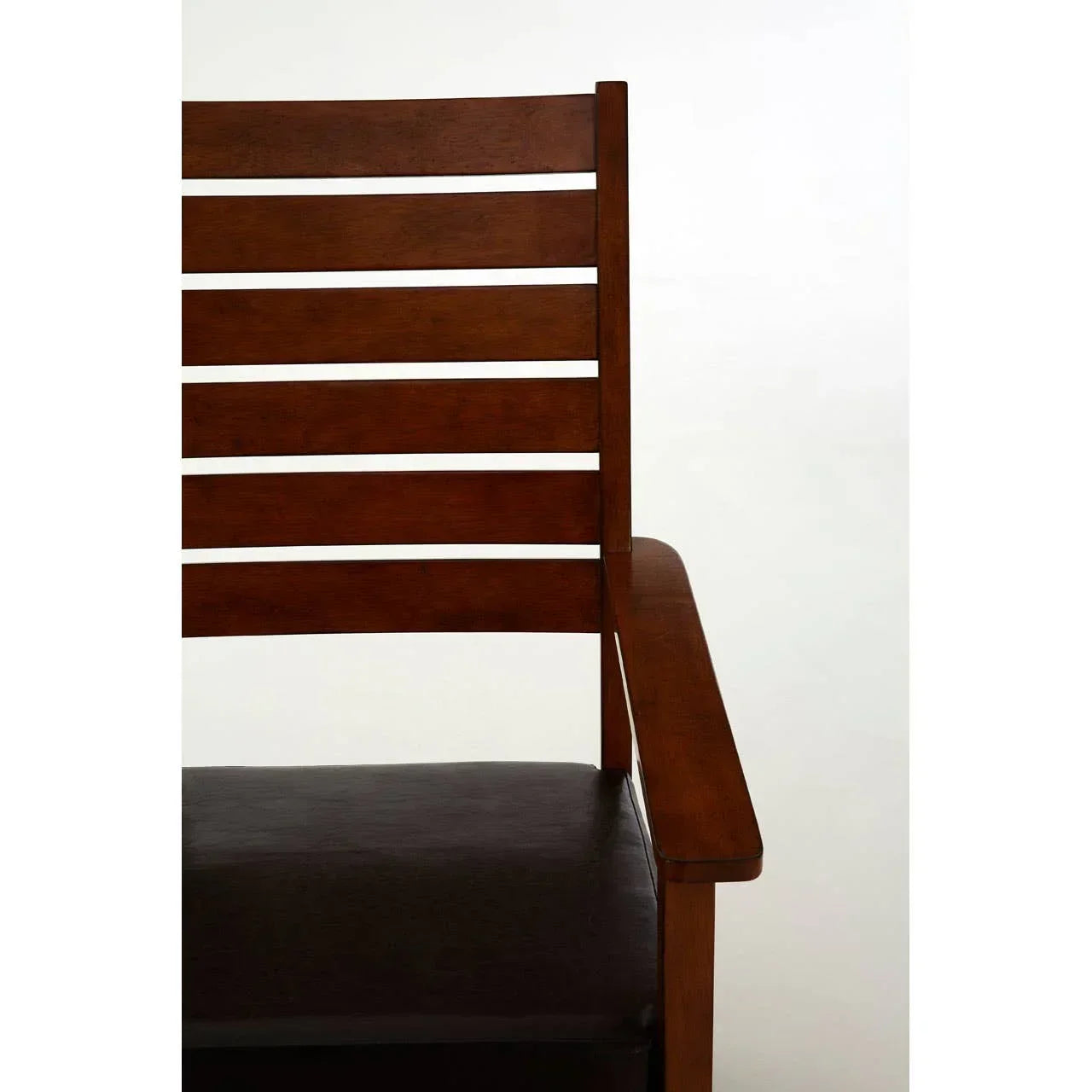 Slatted wooden dining chair with dark cushioned seat, partial side view