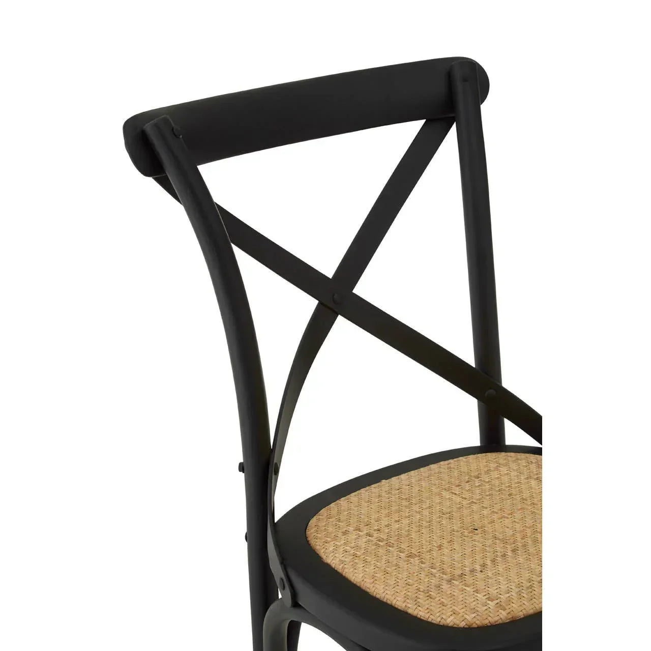 Black cross back dining chair with woven rattan seat, side angle close-up
