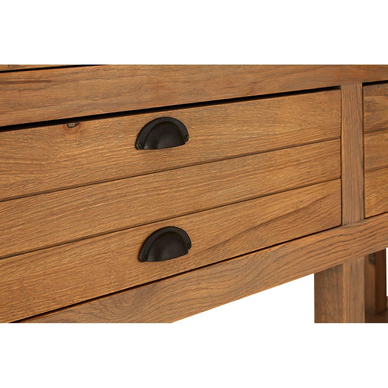 Wooden chest of drawers with black metal handles, close-up of grain and hardware
