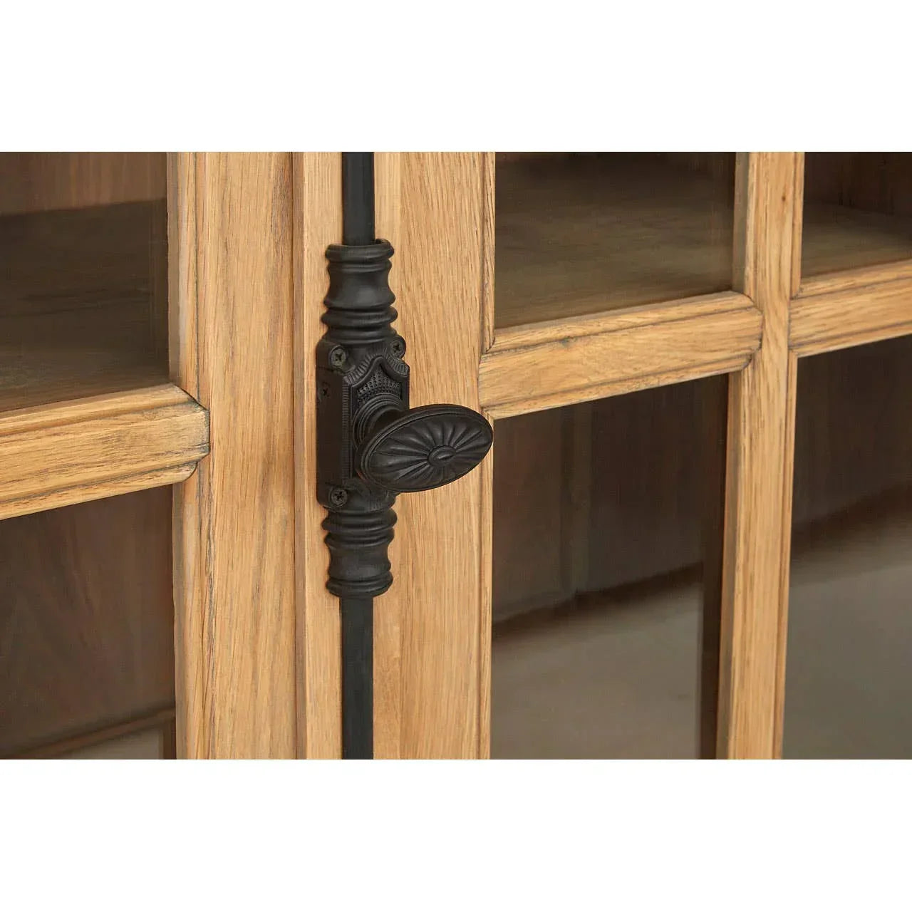 Oak display cabinet door with glass panels and black decorative latch handle