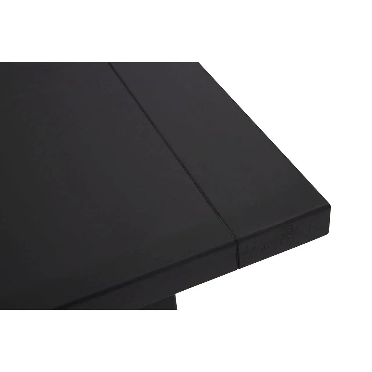 Black dining table corner with smooth wood finish and modern straight edge design