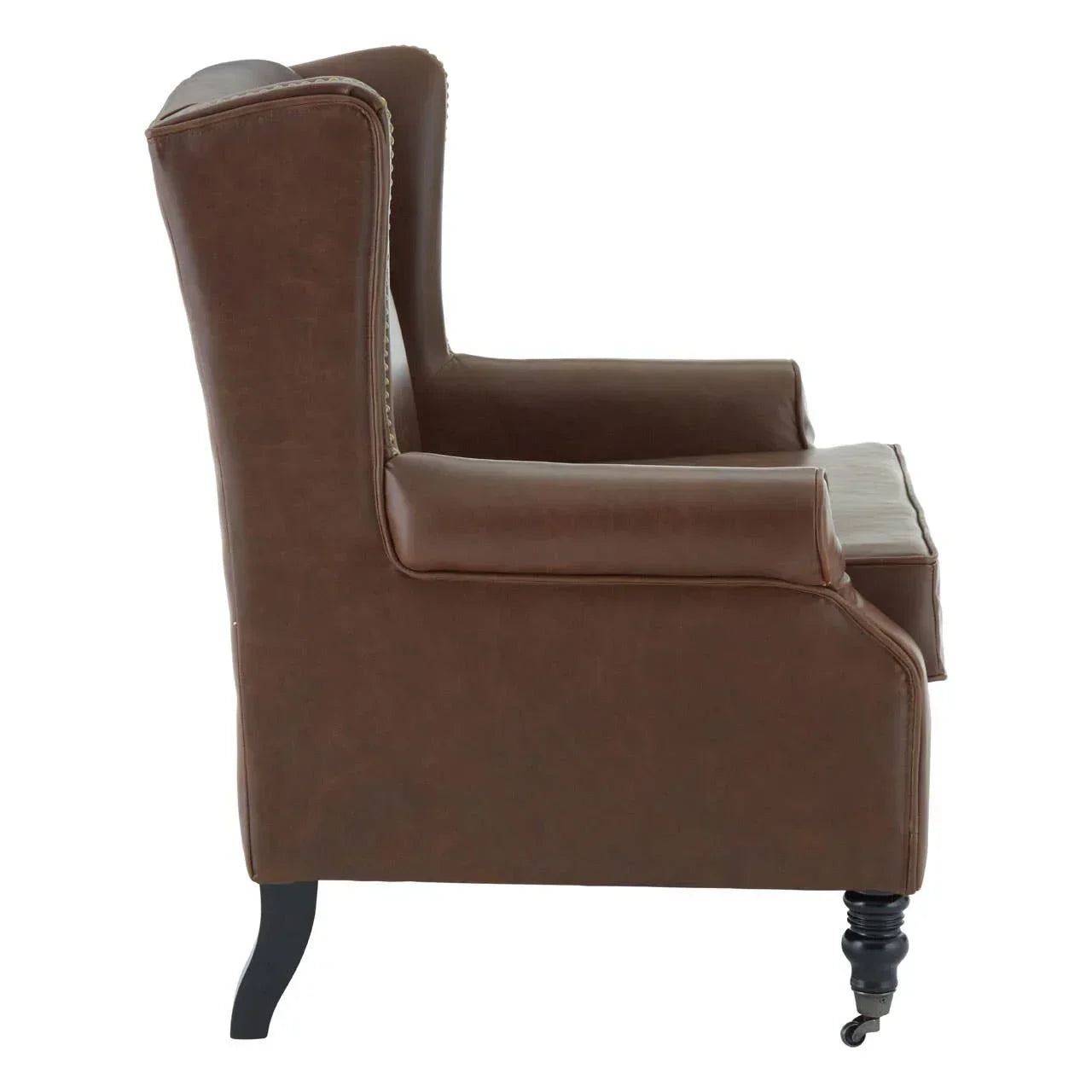 Side view of brown leather armchair with turned wooden legs and castor front feet