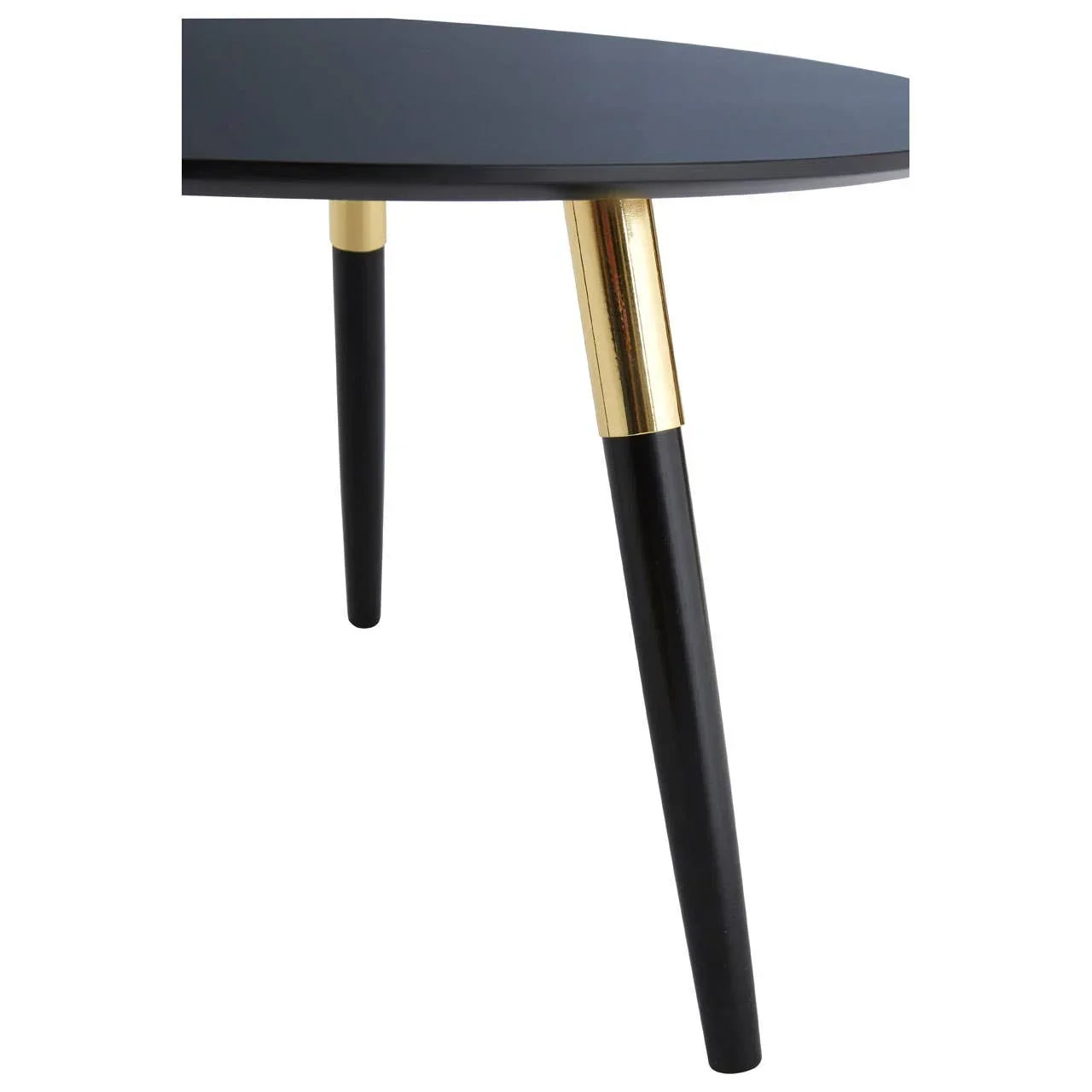 Black and gold coffee table legs with round tabletop close-up