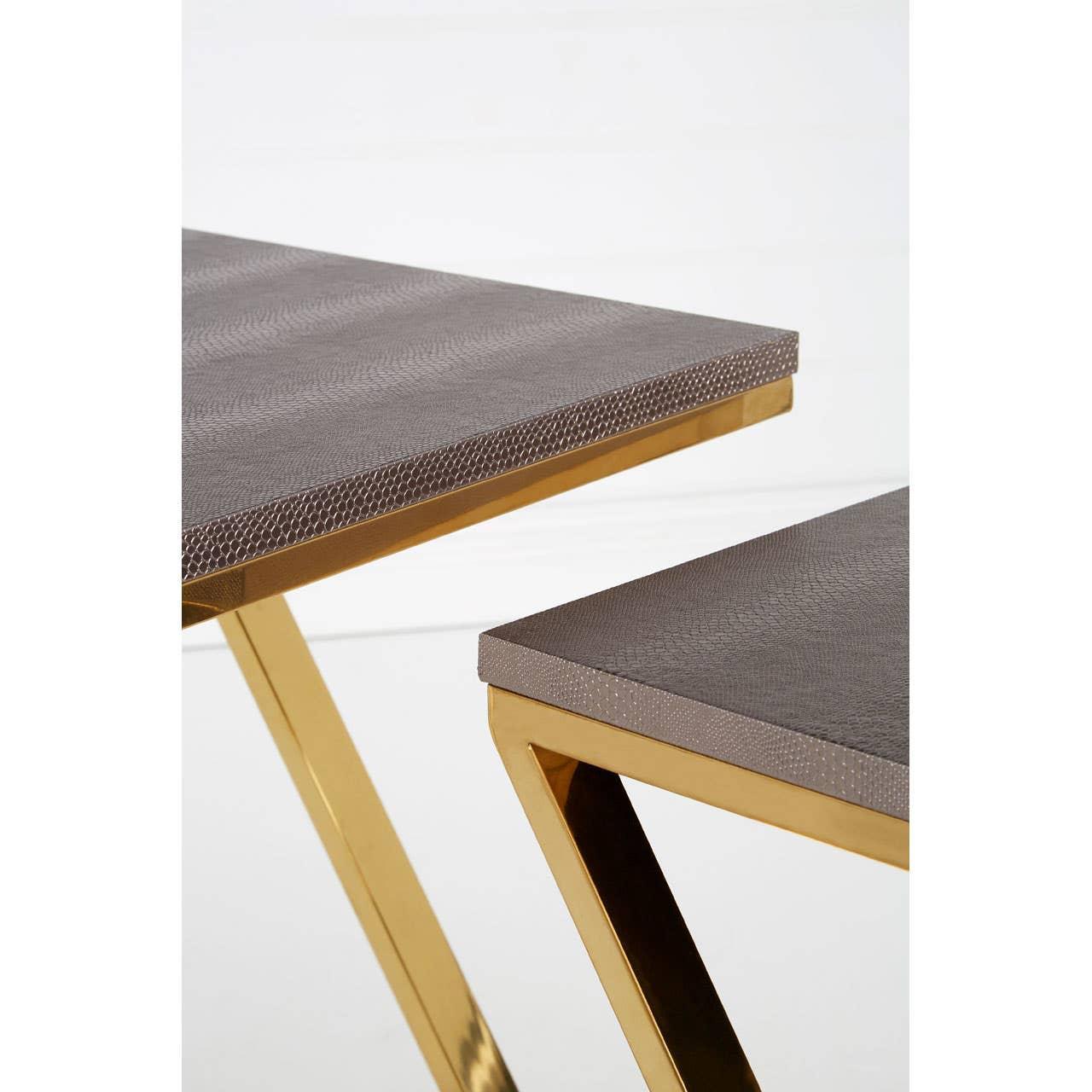 Set of two nesting tables with gold metal legs and textured grey tops