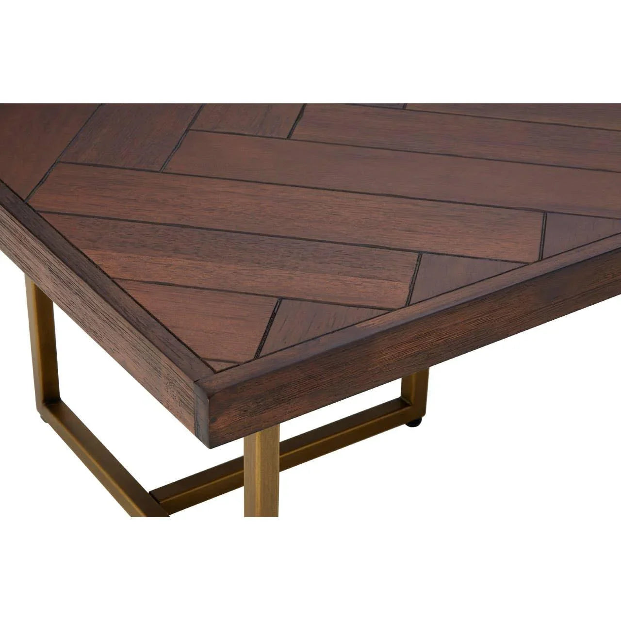 Rectangular wooden coffee table with herringbone pattern and gold metal legs, corner view