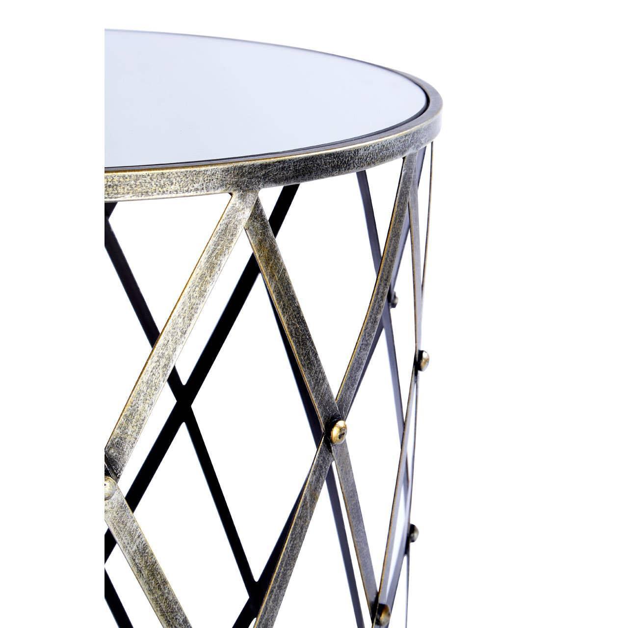 Glass top side table with gold metal lattice frame, close-up view