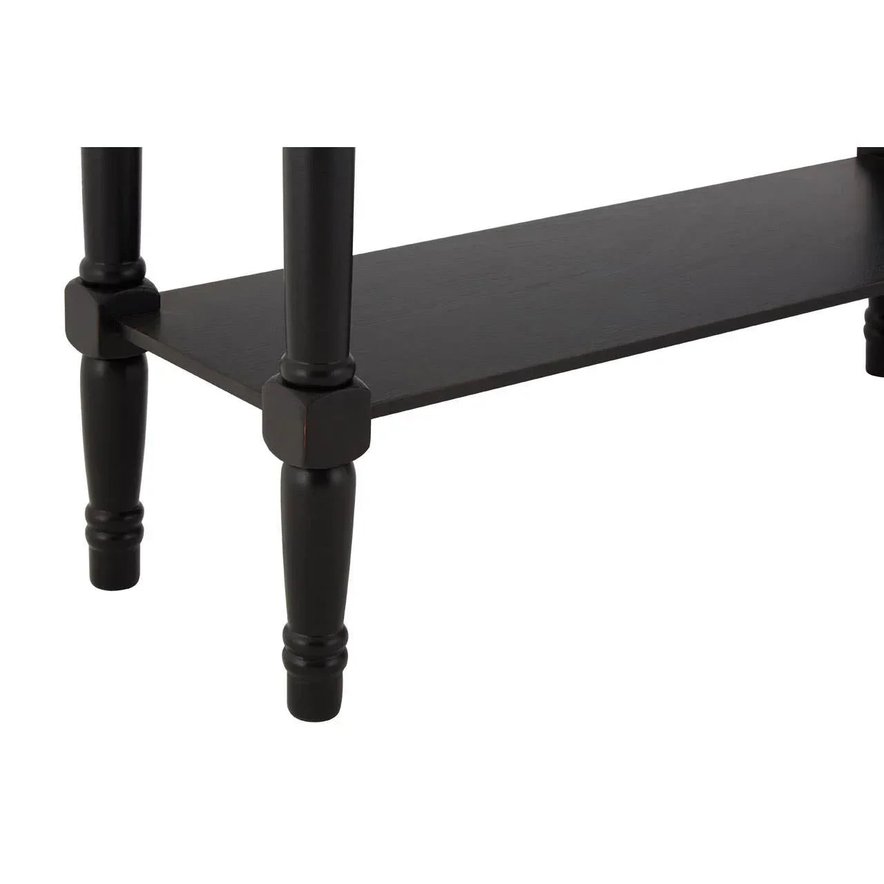 Black wooden furniture leg and shelf closeup showing turned detailing