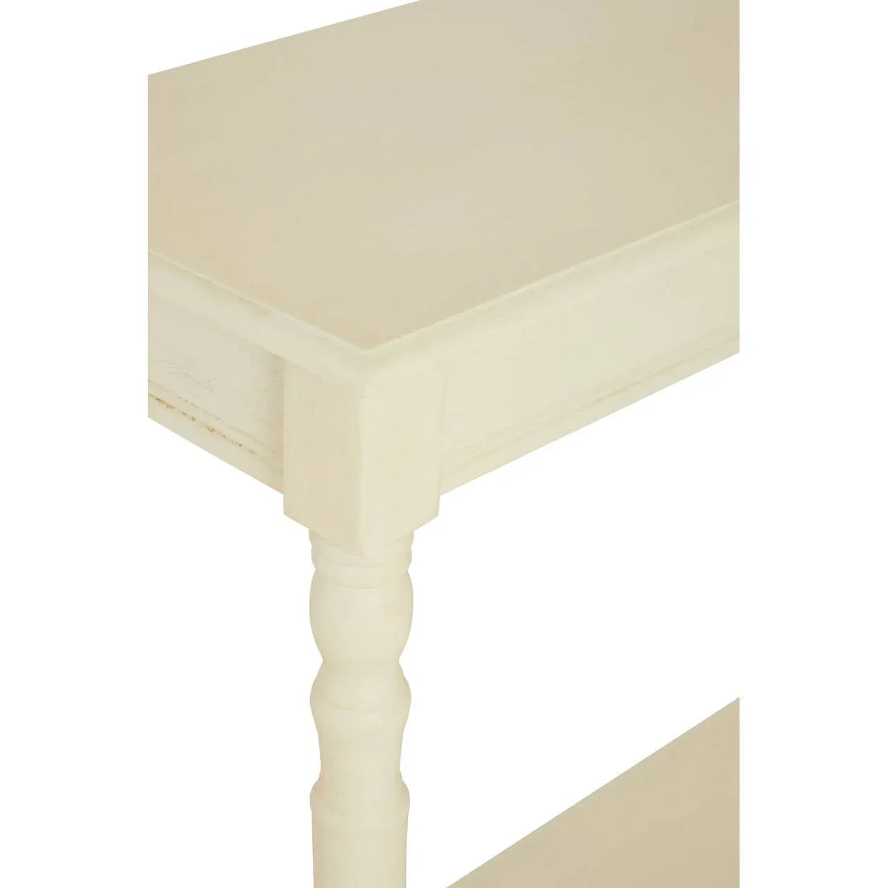 Cream wood console table with turned leg and lower shelf, corner detail view