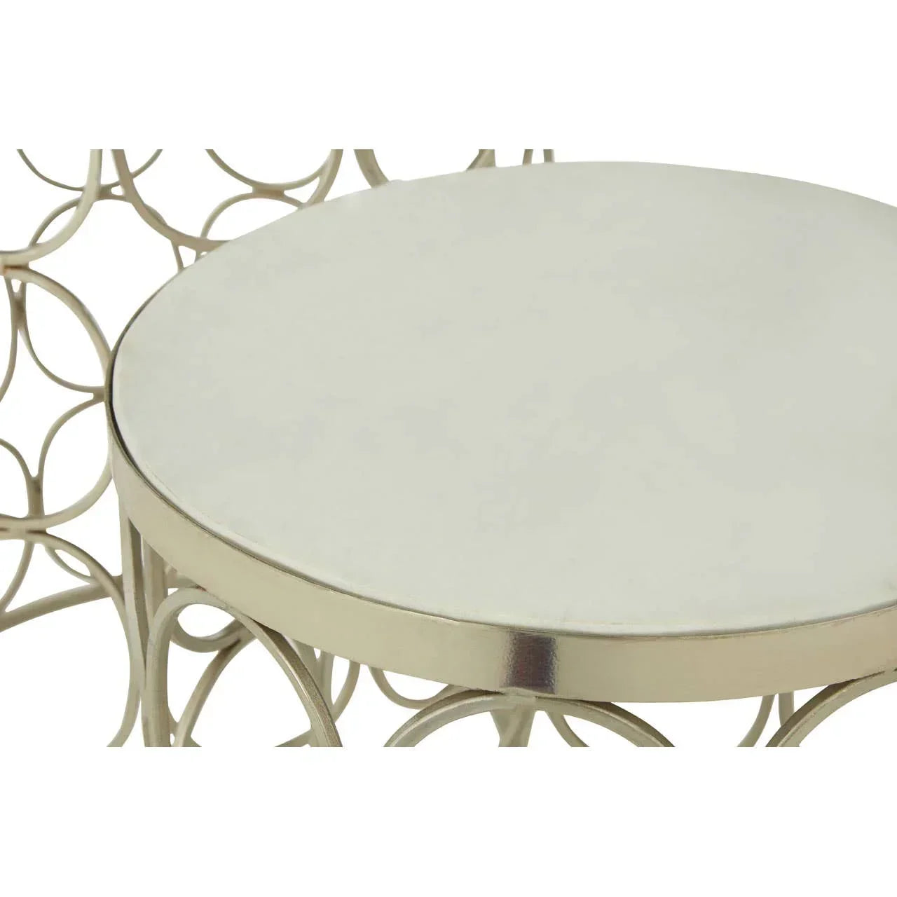 Round metal side table with polished top and decorative looped metal base