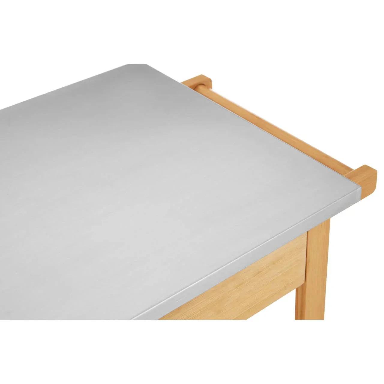 Stainless steel kitchen table top with light wood legs, close corner view