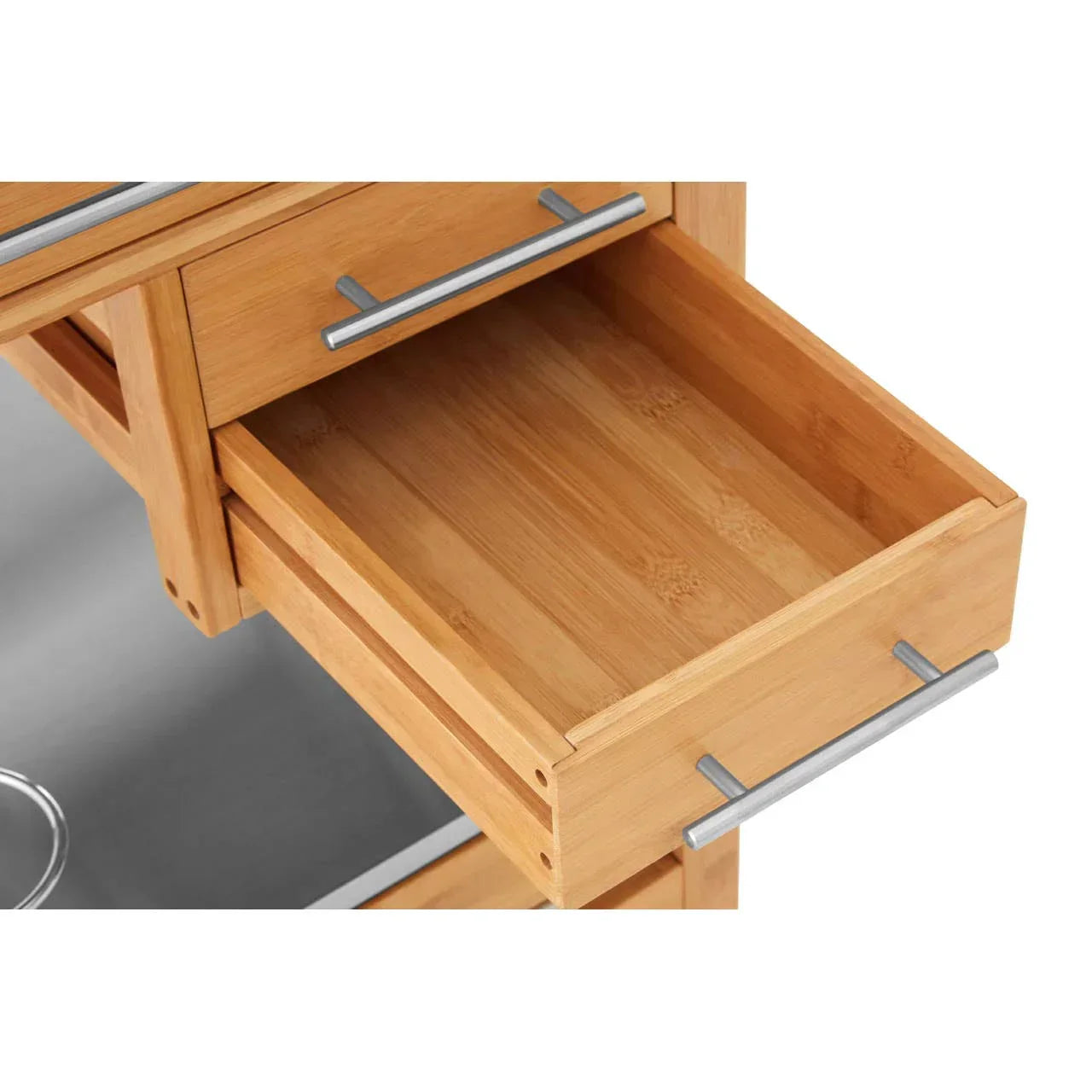 Open wooden kitchen trolley drawer with metal handle on light surface