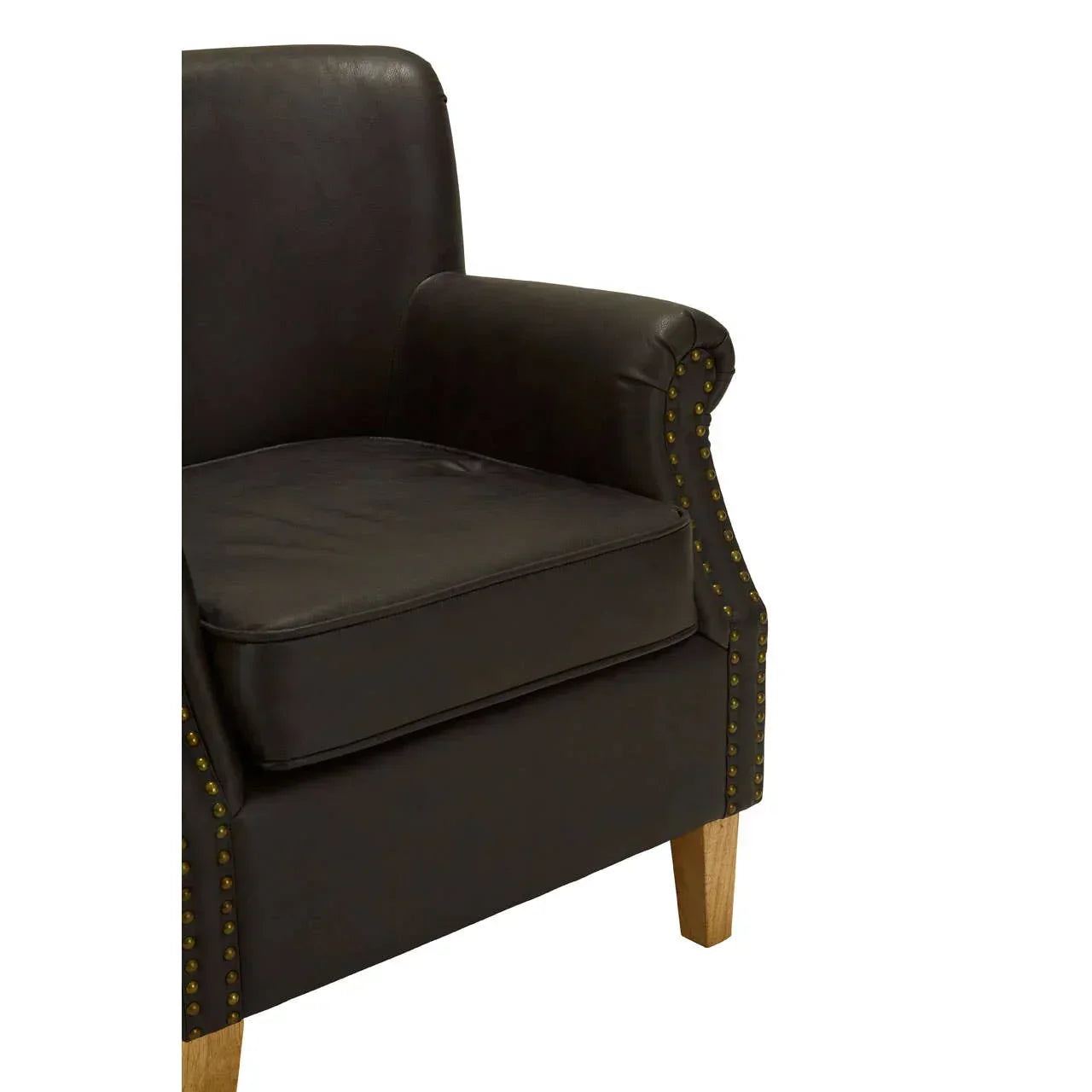 Dark brown leather armchair close-up with wooden legs and brass stud detailing