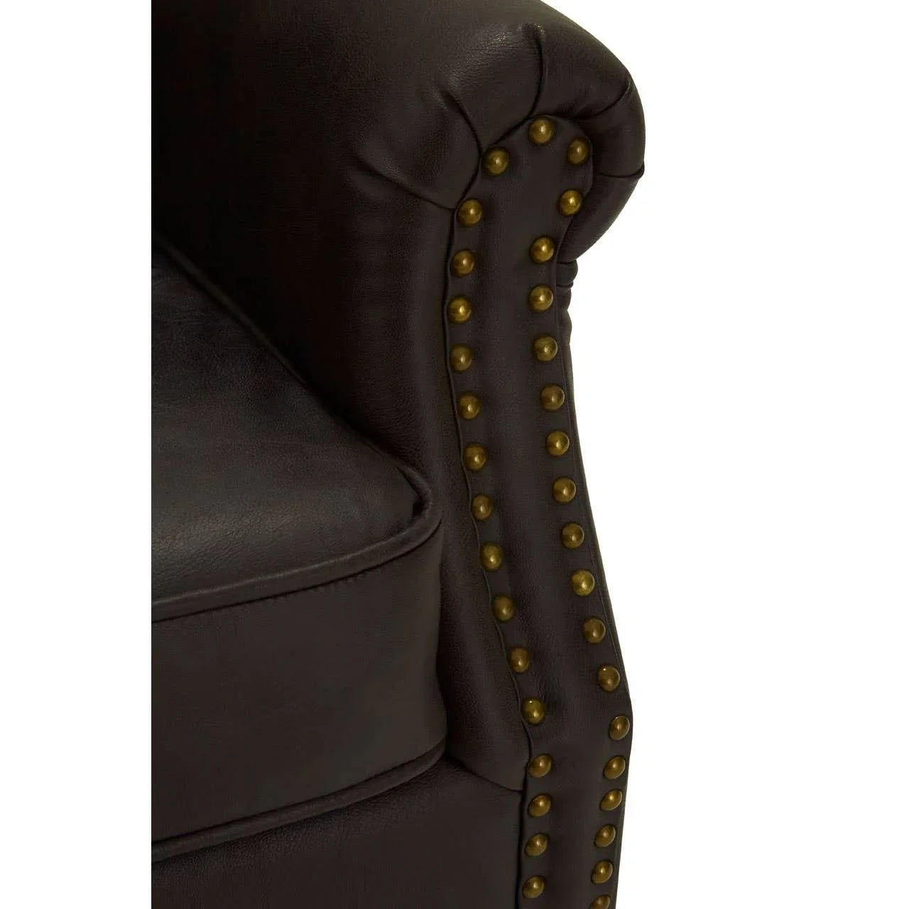 Brown leather sofa arm with brass stud detailing and padded cushion
